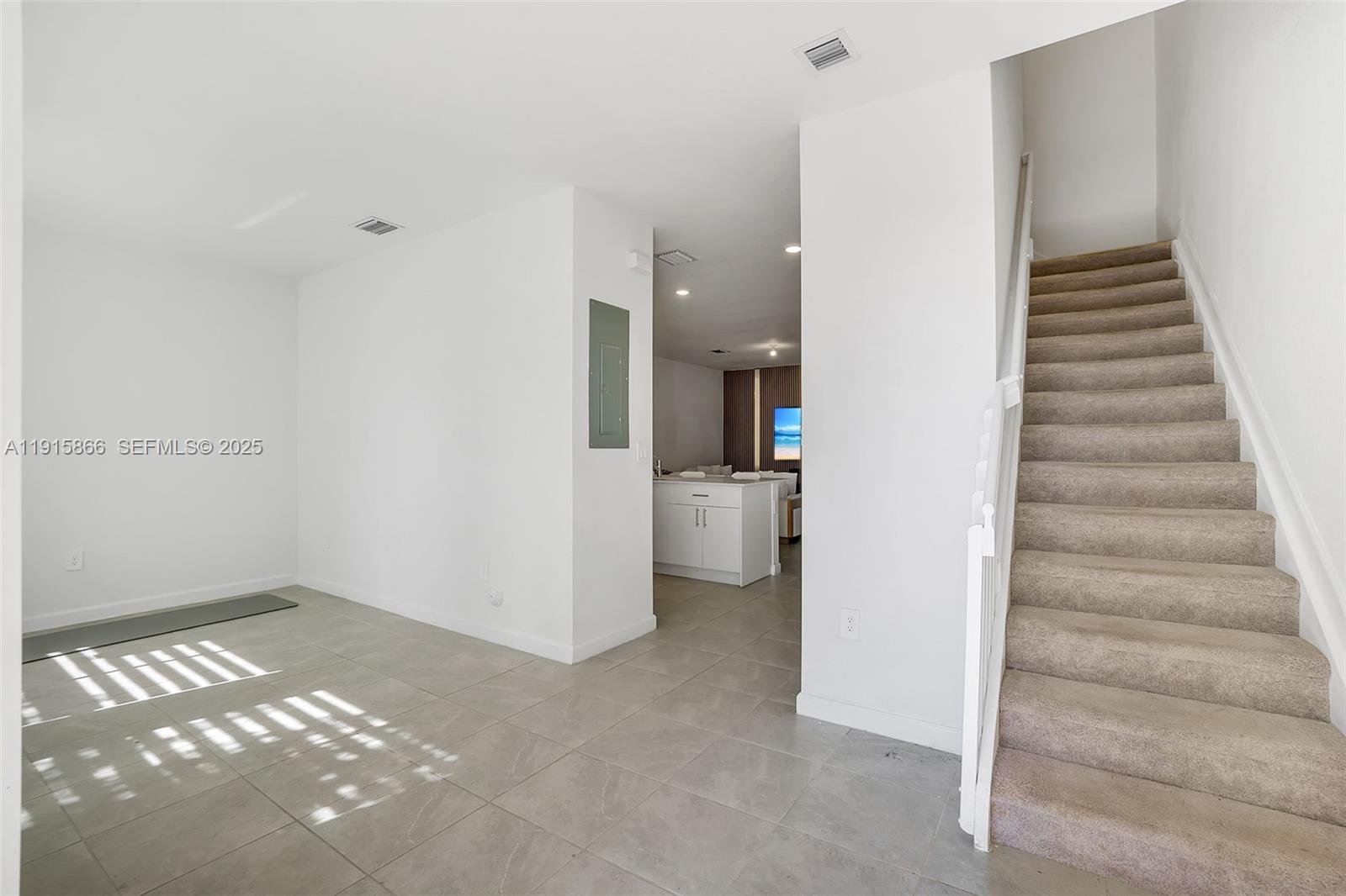 12859 Southwest 243rd Terrace Homestead, FL 33032 - Photo 15 of 38 a view of a hallway with entryway and stairs