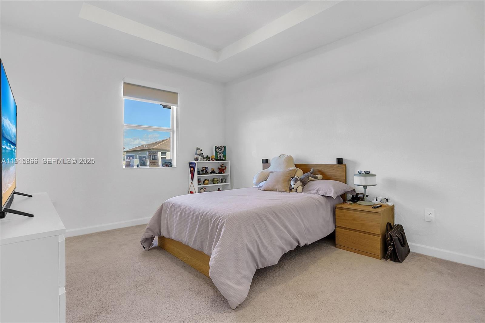 12859 Southwest 243rd Terrace Homestead, FL 33032 - Photo 17 of 38 a bedroom with a bed and window