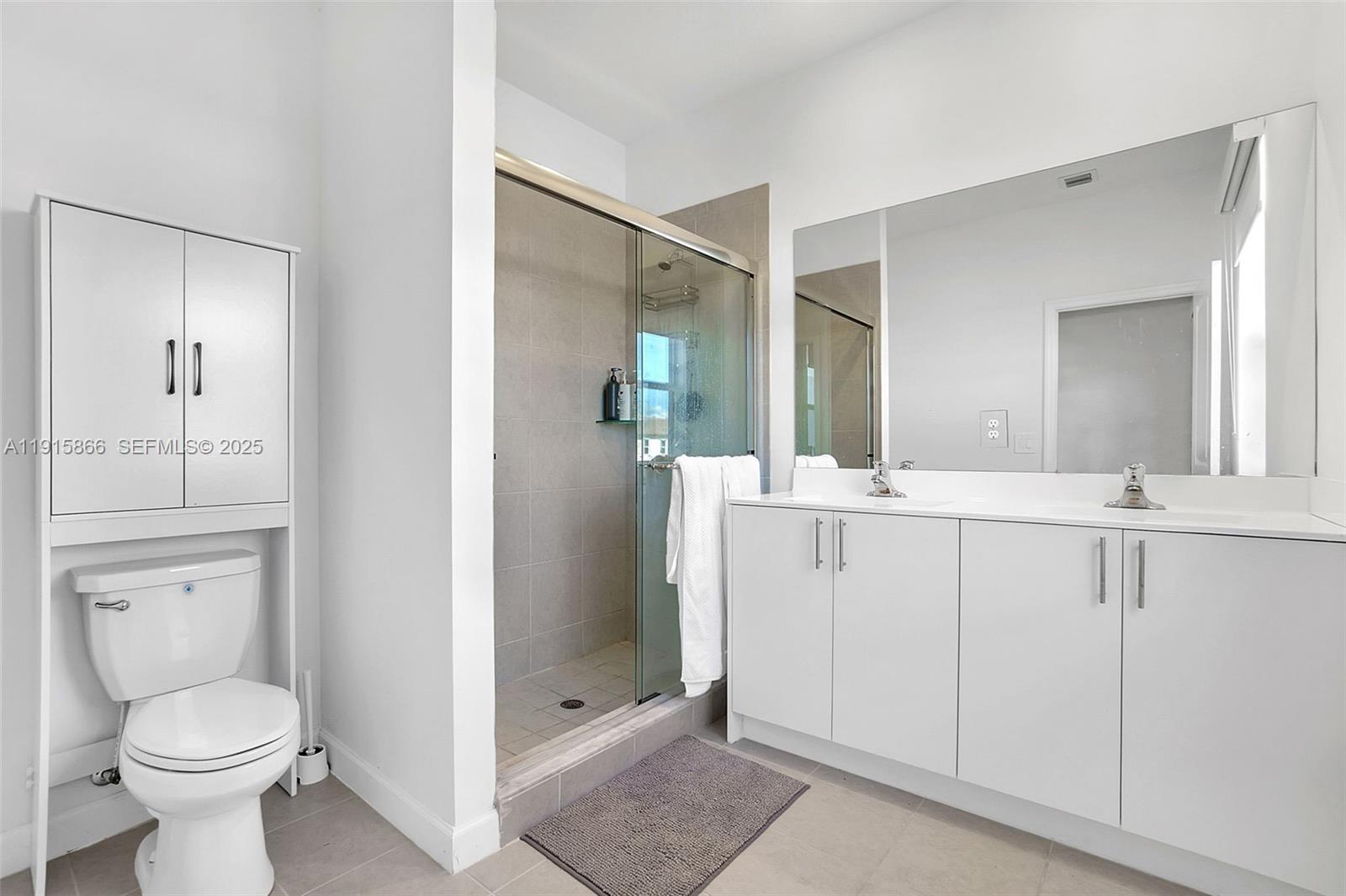 12859 Southwest 243rd Terrace Homestead, FL 33032 - Photo 20 of 38 a bathroom with a toilet sink and shower