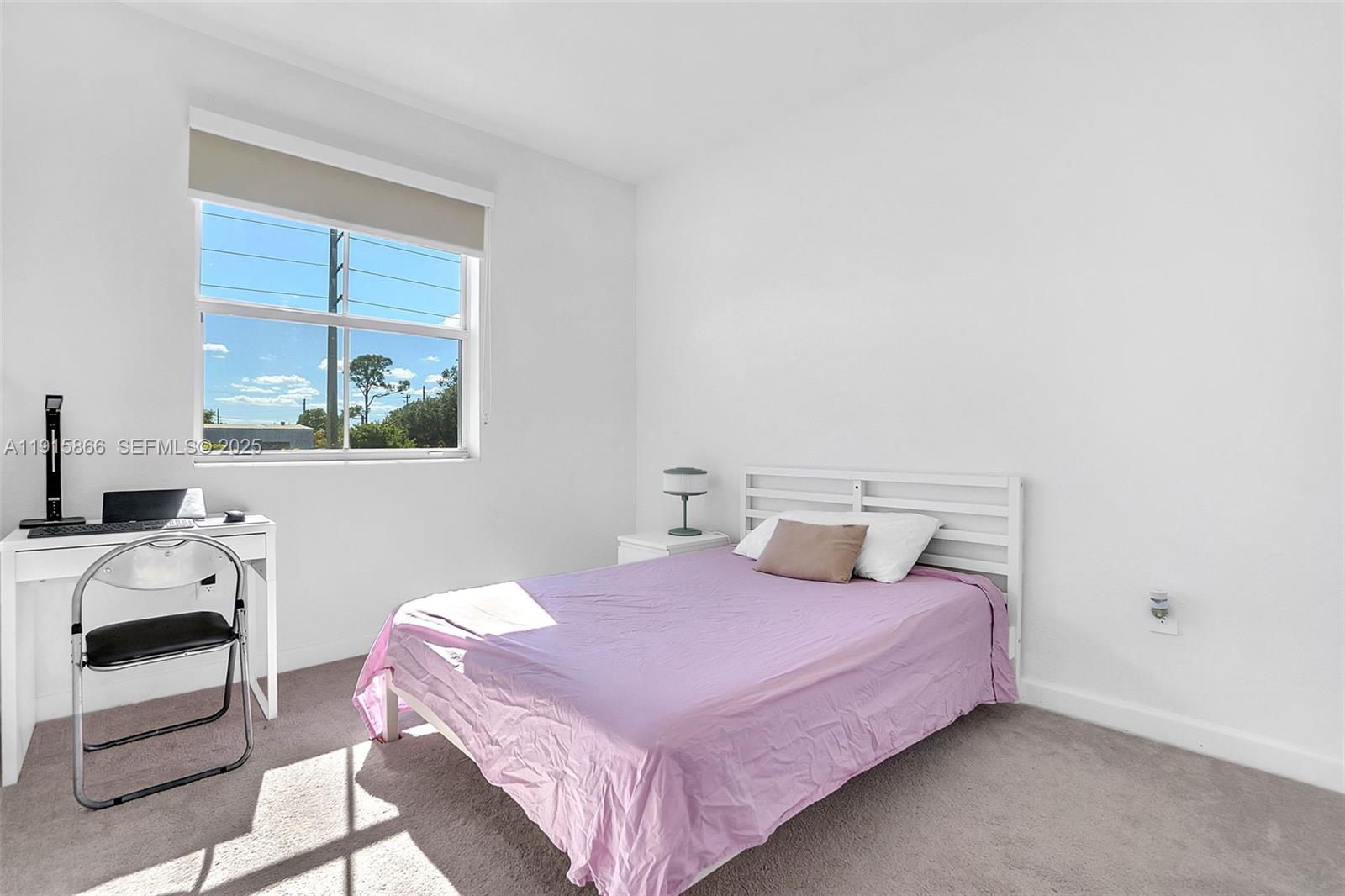 12859 Southwest 243rd Terrace Homestead, FL 33032 - Photo 21 of 38 a bedroom with a bed and a window