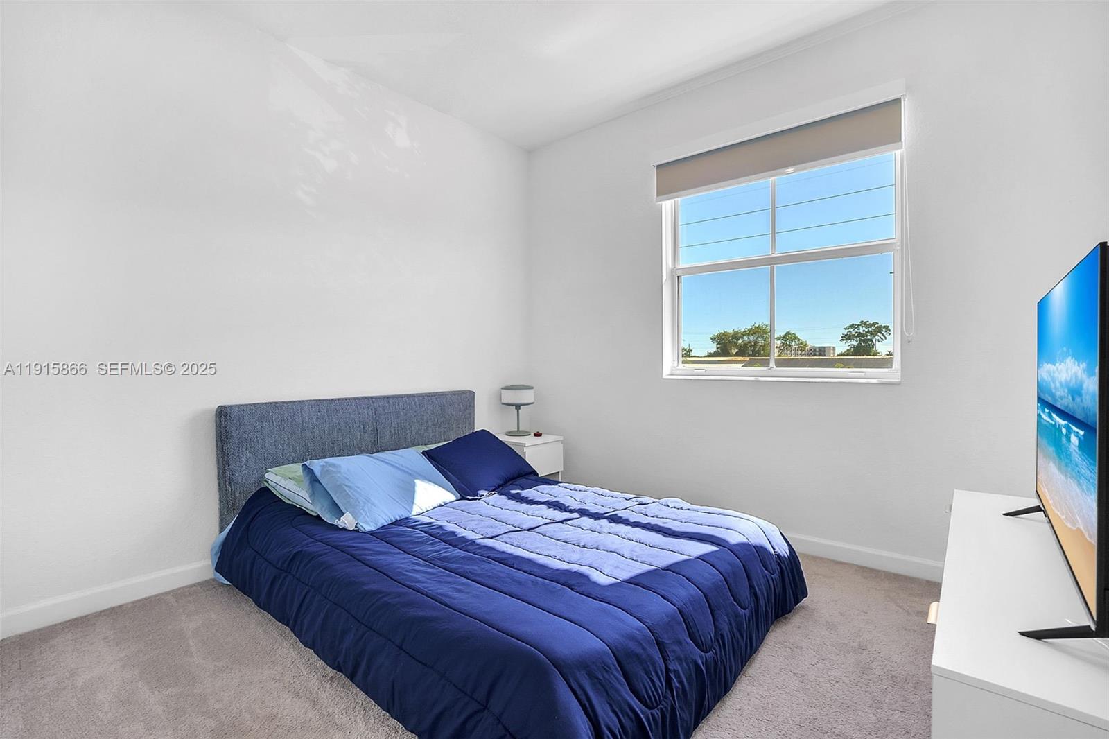 12859 Southwest 243rd Terrace Homestead, FL 33032 - Photo 24 of 38 a bedroom with a bed and a window