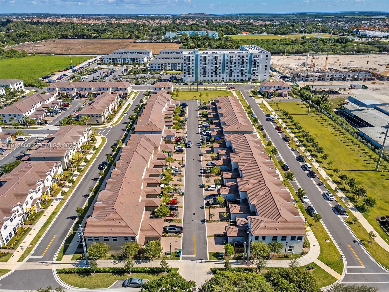12859 Southwest 243rd Terrace Homestead, FL 33032 - Photo 34 of 38 an aerial view of a city with swimming pool