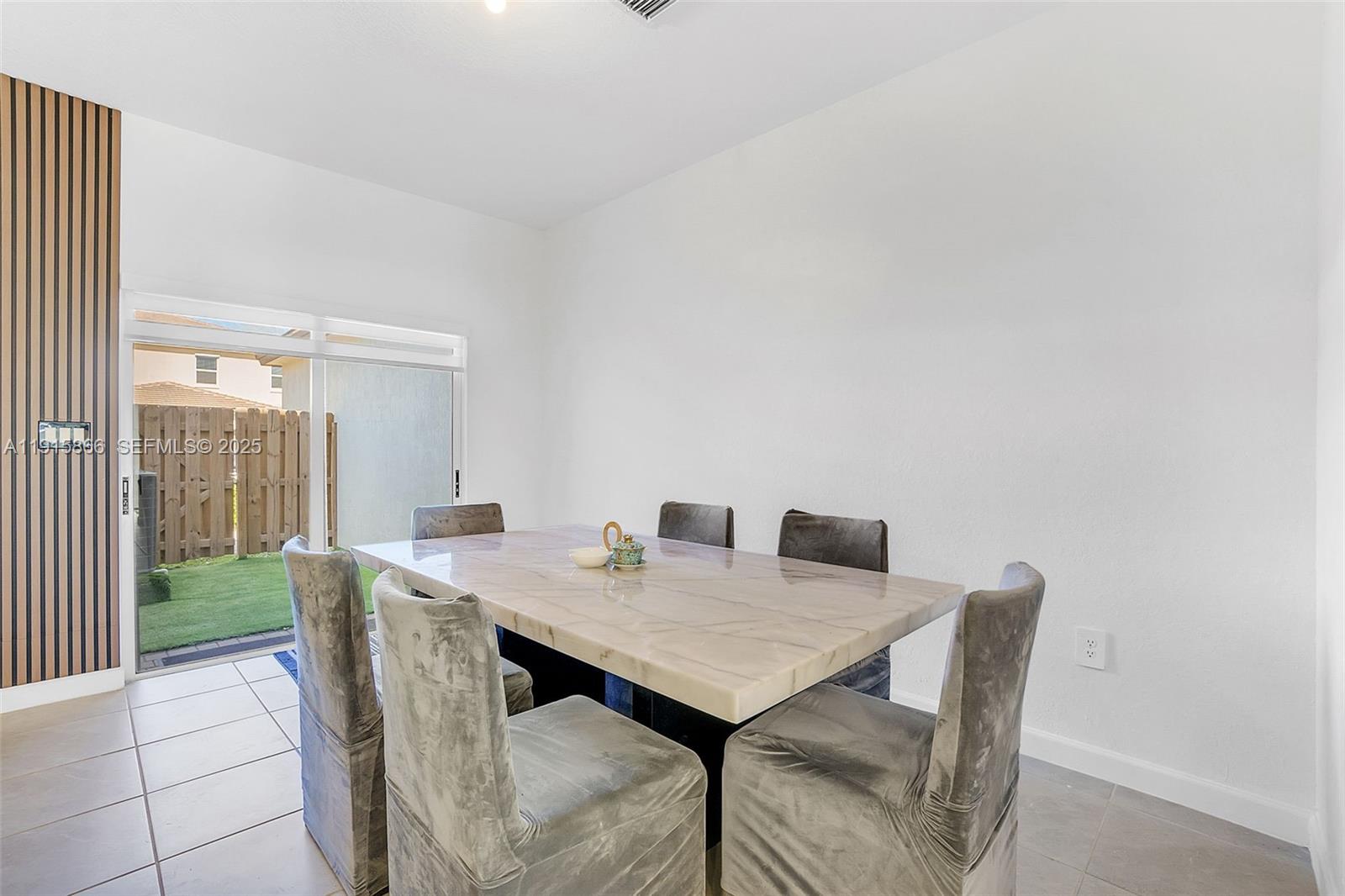 12859 Southwest 243rd Terrace Homestead, FL 33032 - Photo 9 of 38 a view of a dining room with furniture and wooden floor
