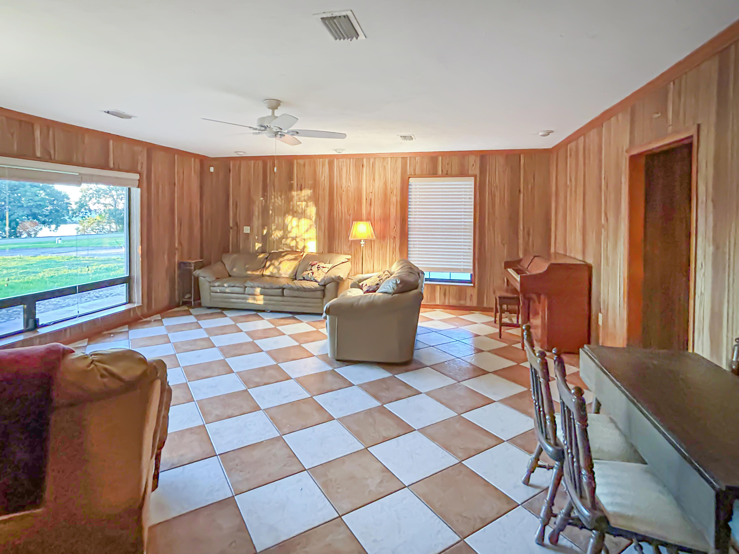 2531 River Road Moore Haven, FL 33471 - Photo 13 of 30 a living room with furniture and a flat screen tv