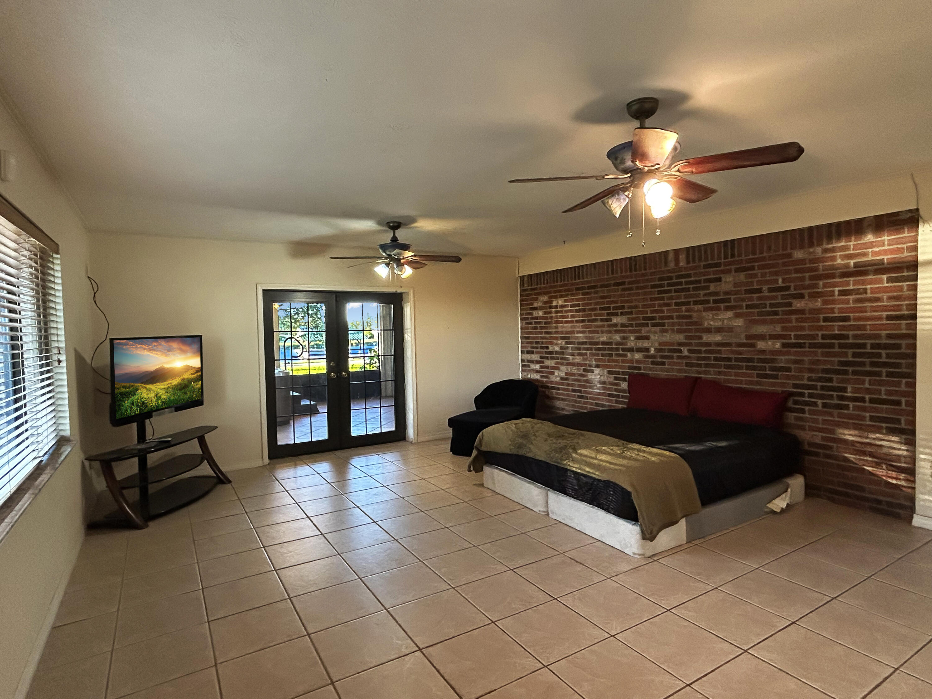 2531 River Road Moore Haven, FL 33471 - Photo 15 of 30 a living room with furniture and a flat screen tv