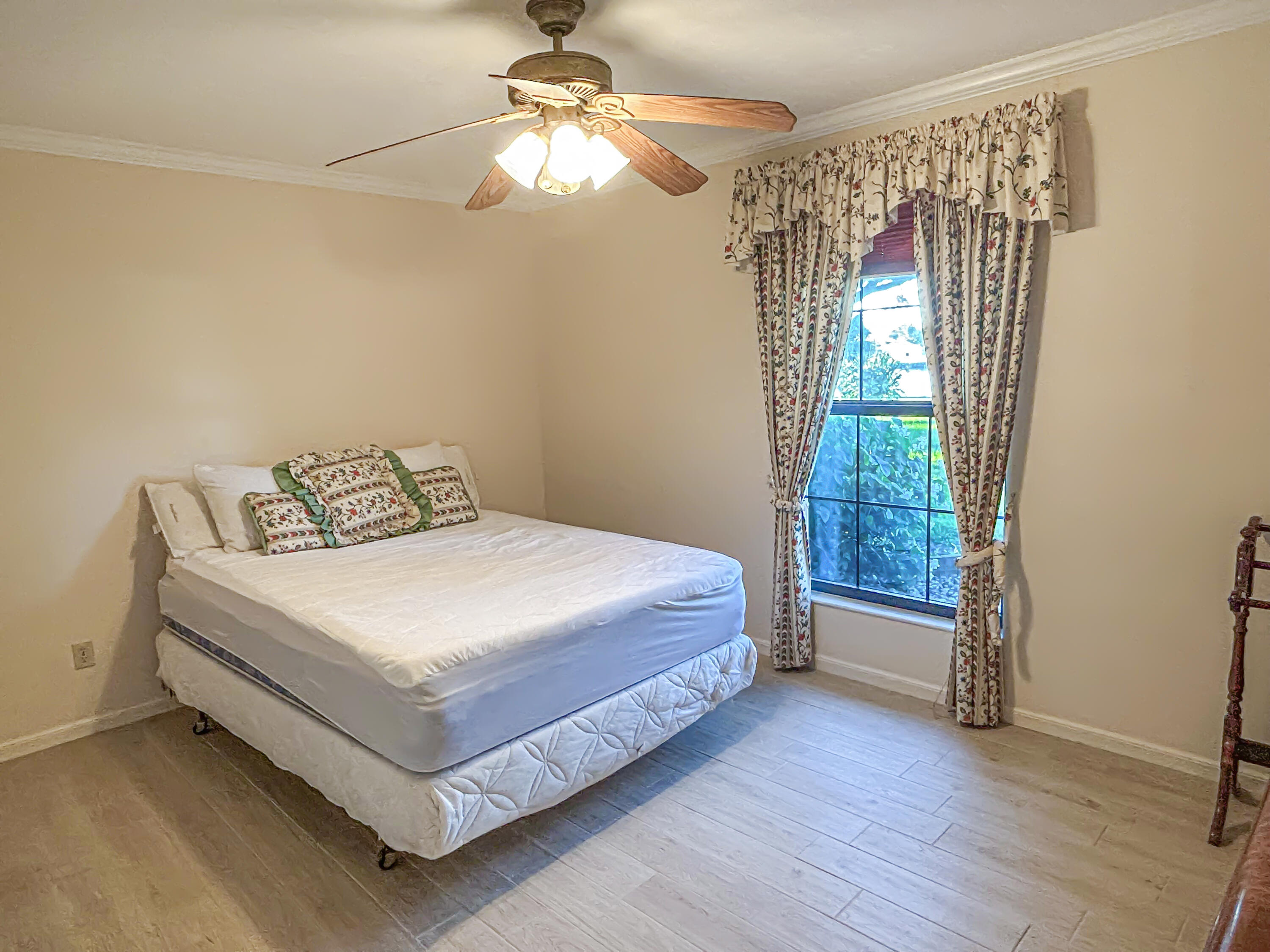 2531 River Road Moore Haven, FL 33471 - Photo 19 of 30 a bedroom with a bed and window
