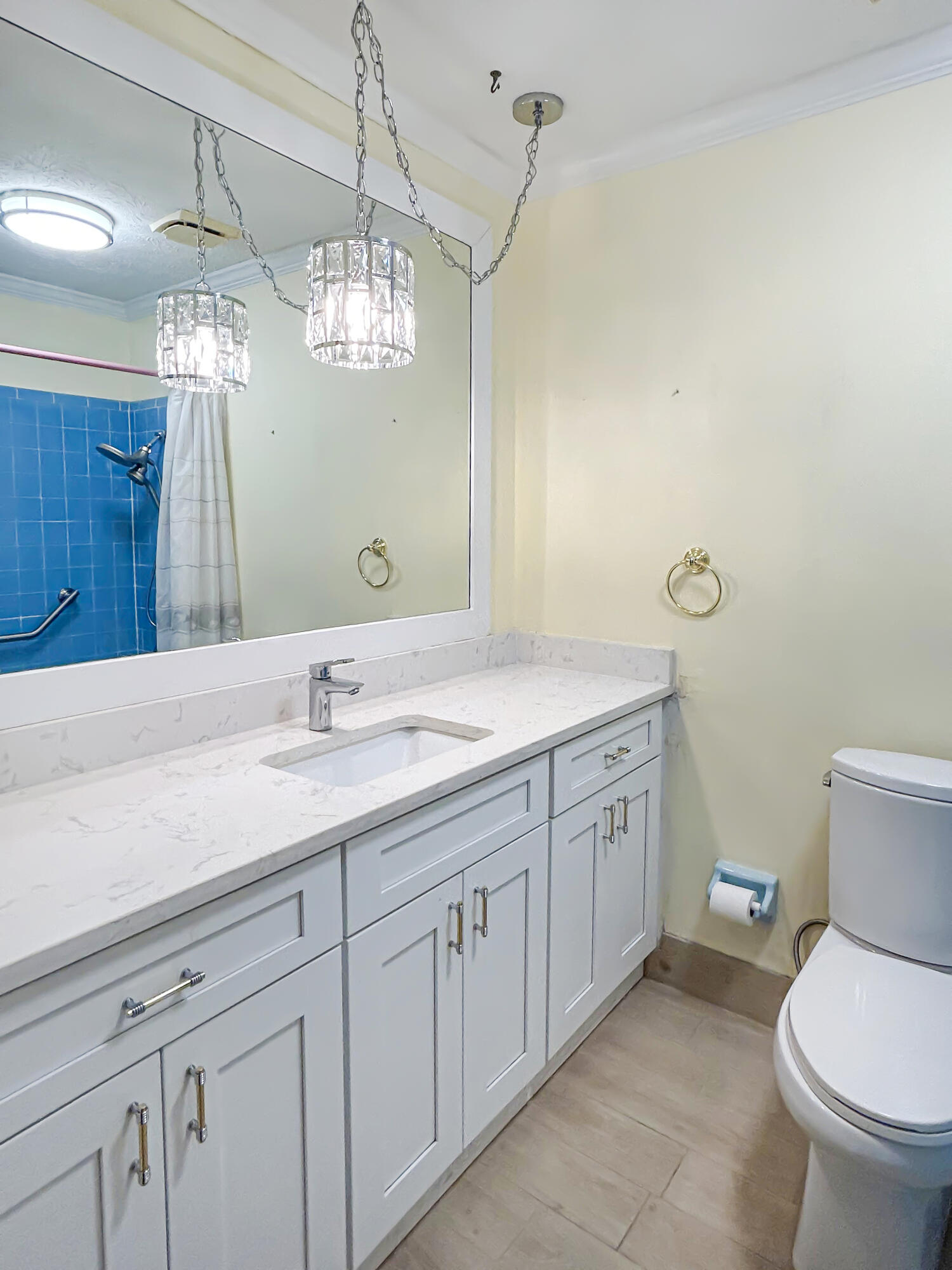 2531 River Road Moore Haven, FL 33471 - Photo 20 of 30 a bathroom with a granite countertop sink a toilet and a mirror