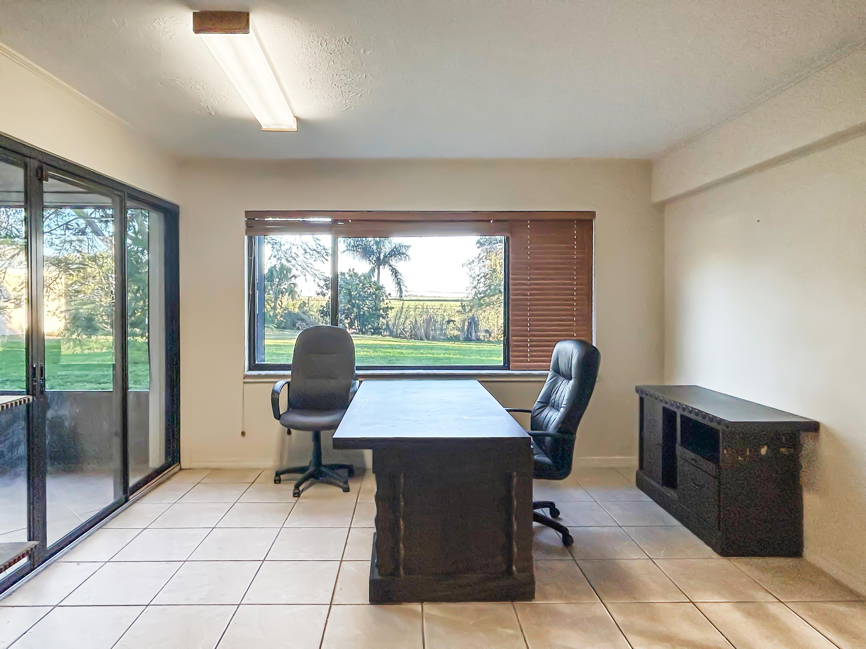 2531 River Road Moore Haven, FL 33471 - Photo 22 of 30 a view of a workspace with furniture and a window