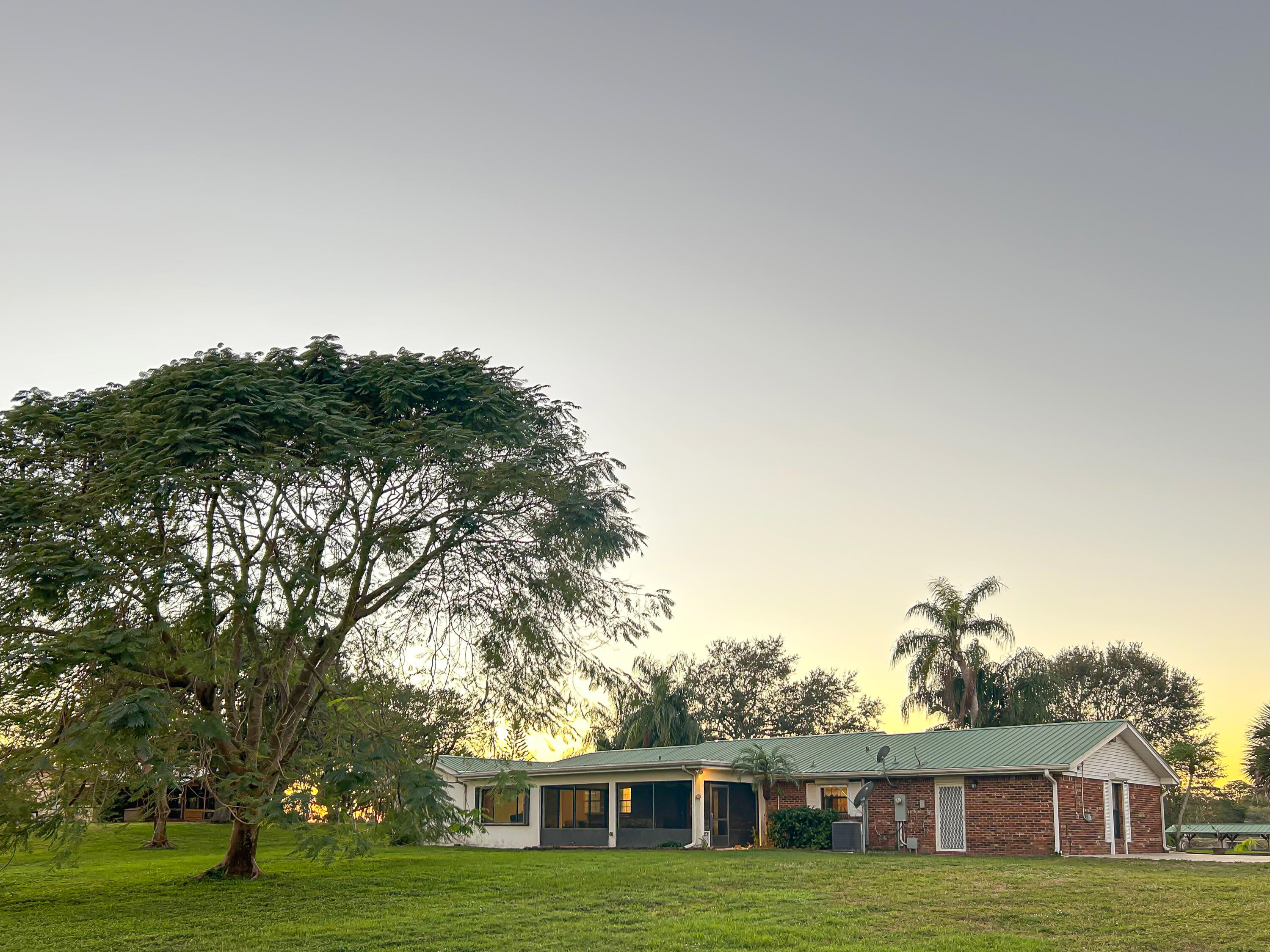2531 River Road Moore Haven, FL 33471 - Photo 27 of 30 a view of a house with a yard