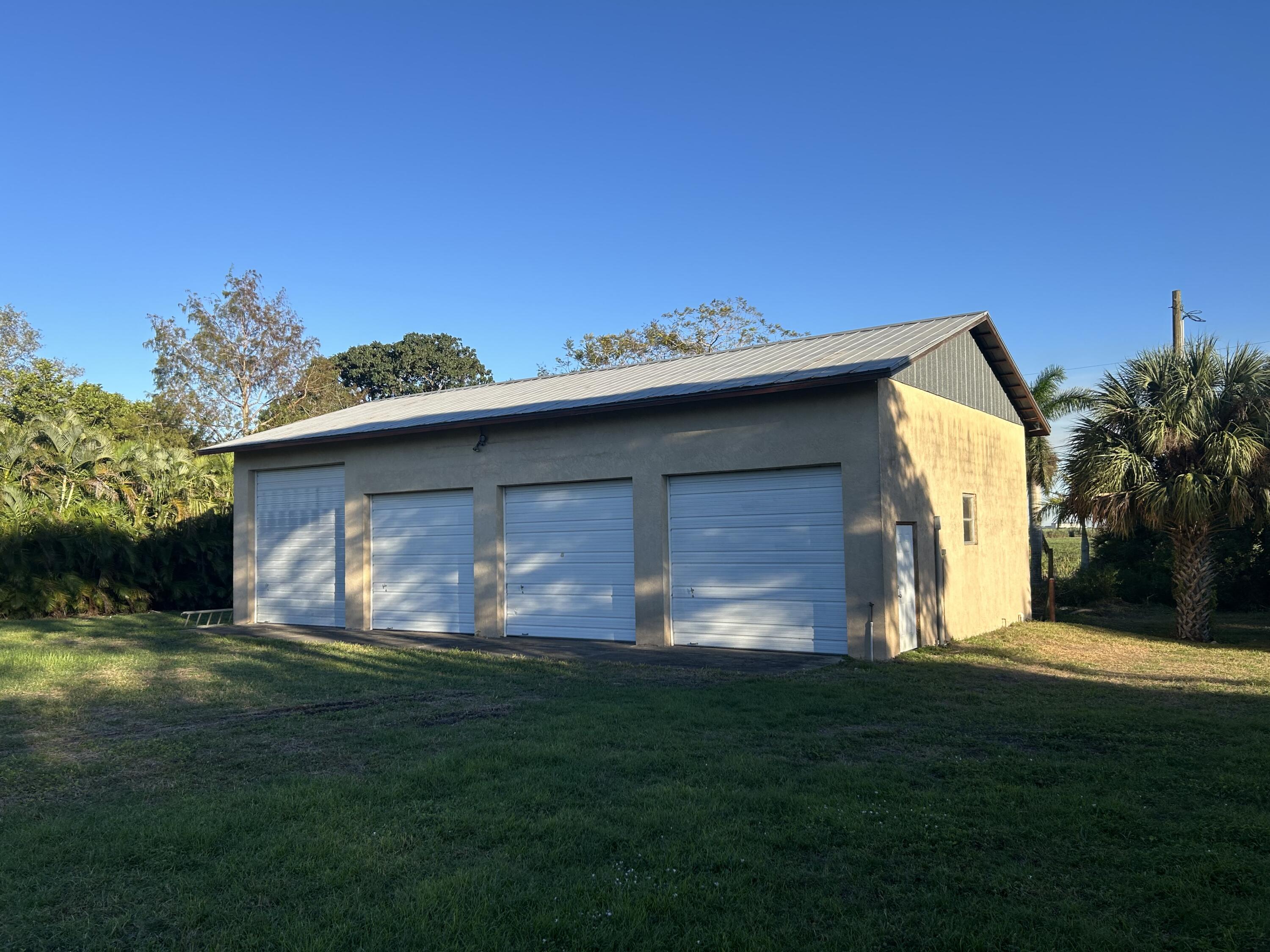 2531 River Road Moore Haven, FL 33471 - Photo 28 of 30 a view of a backyard with a garden