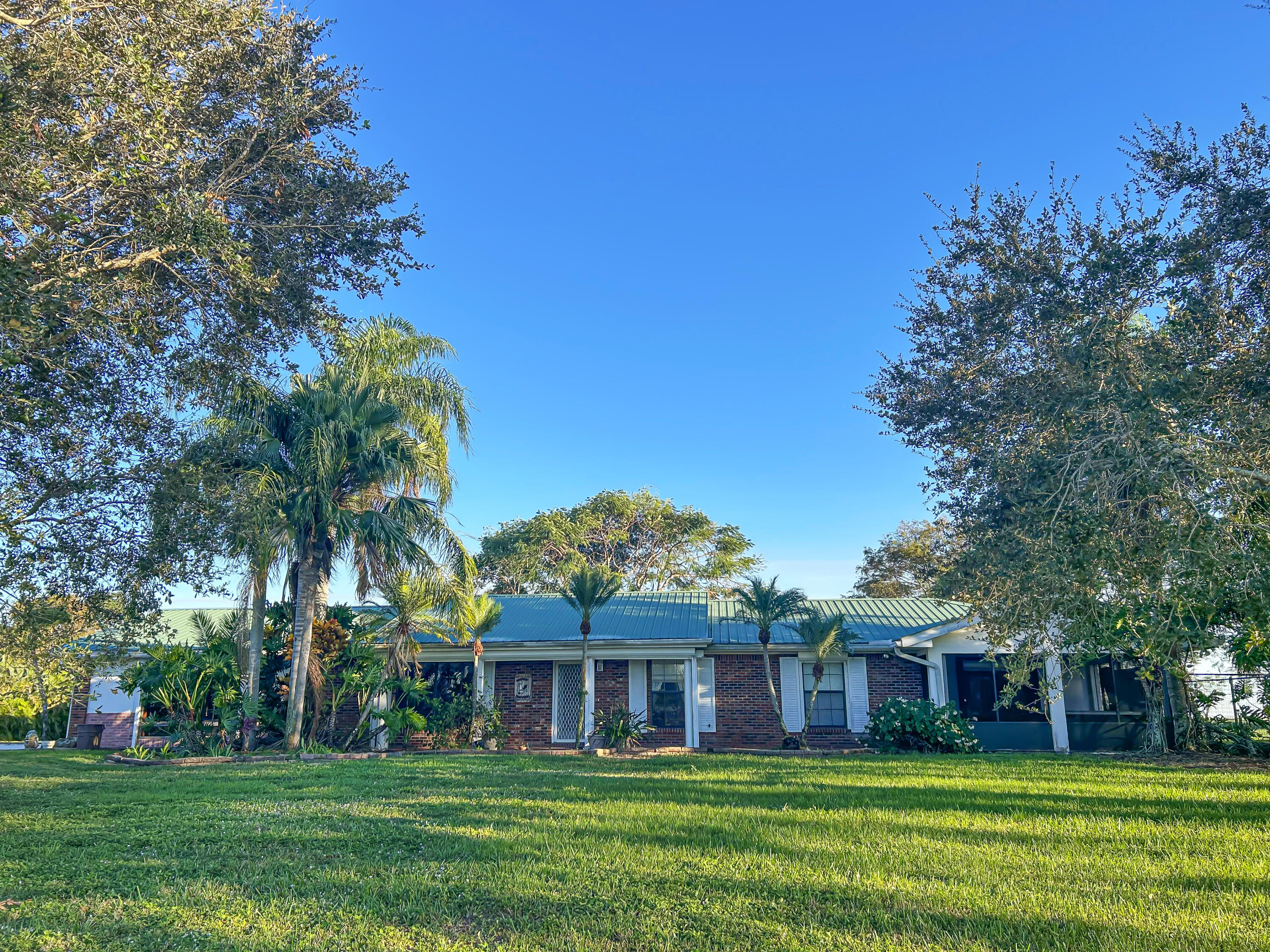 2531 River Road Moore Haven, FL 33471 - Photo 3 of 30 a front view of house with yard and green space