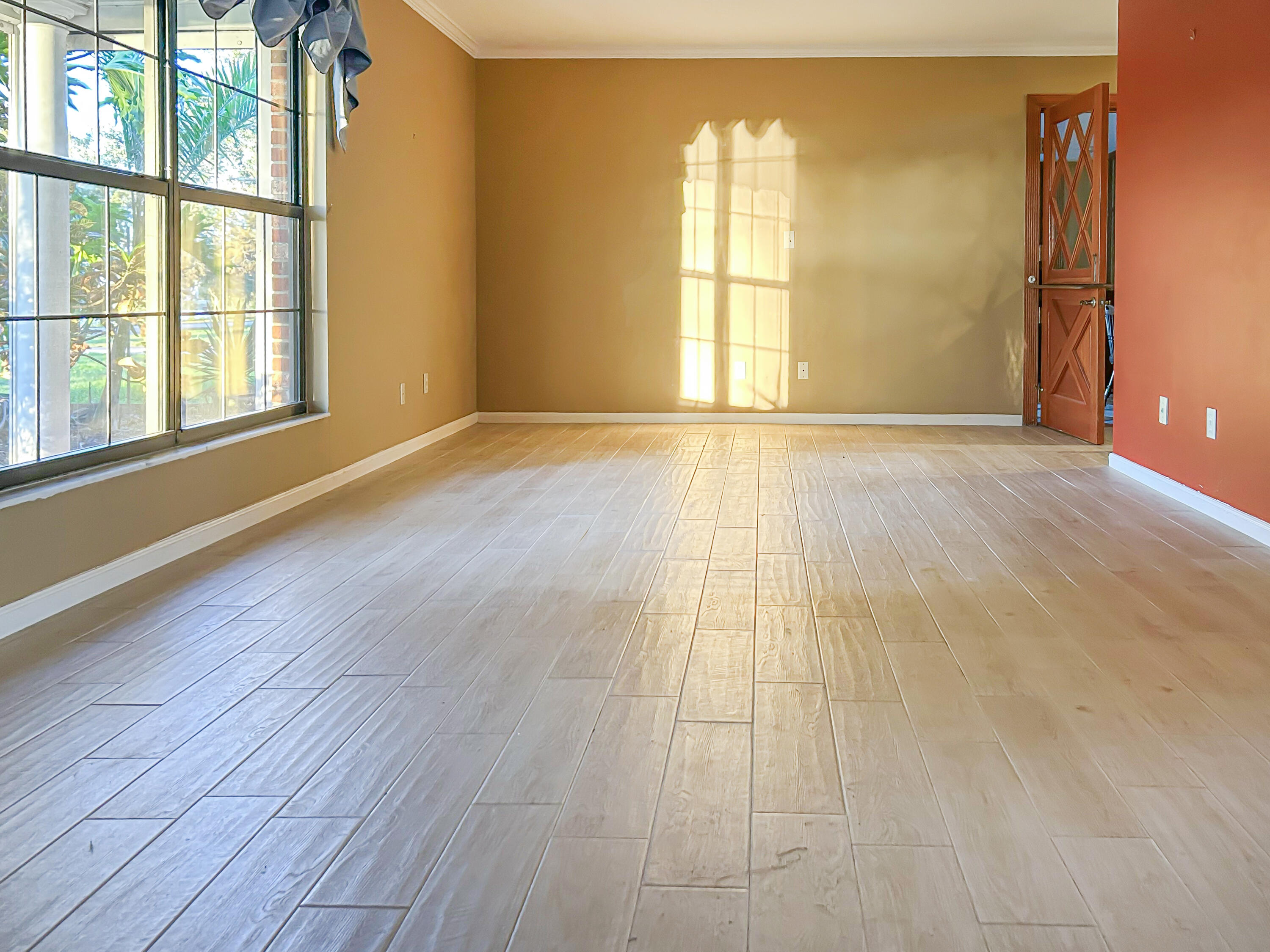 2531 River Road Moore Haven, FL 33471 - Photo 8 of 30 a view of an empty room with wooden floor and a window