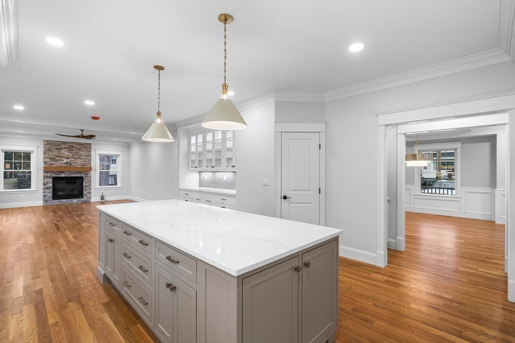 49 Allen Road Winchester, MA 01890 - Photo 11 of 38 a view of a kitchen with center island and wooden floor