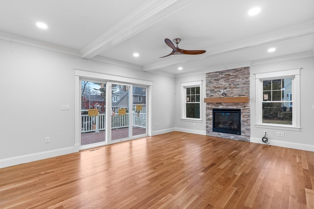 49 Allen Road Winchester, MA 01890 - Photo 16 of 38 a view of an empty room with wooden floor and a fireplace