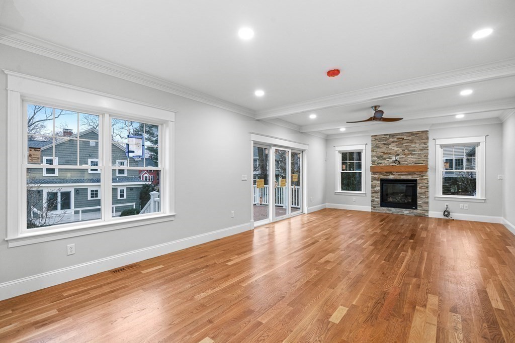 49 Allen Road Winchester, MA 01890 - Photo 17 of 38 a view of an empty room with wooden floor and a window