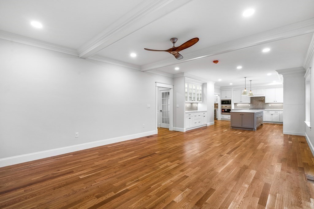 49 Allen Road Winchester, MA 01890 - Photo 18 of 38 a view of an empty room with kitchen appliances and a ceiling fan