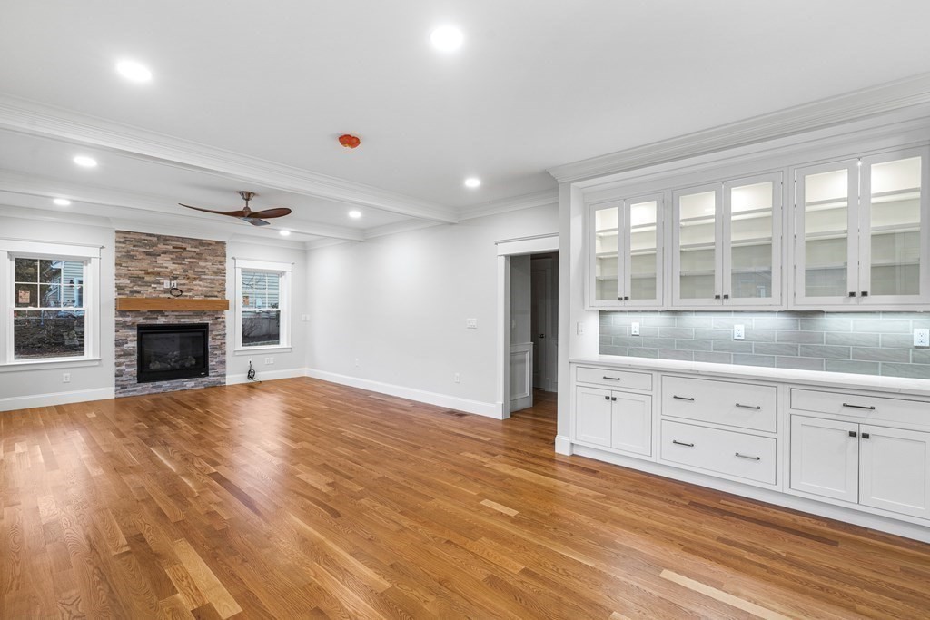 49 Allen Road Winchester, MA 01890 - Photo 20 of 38 a view of an empty room with a fireplace and a window