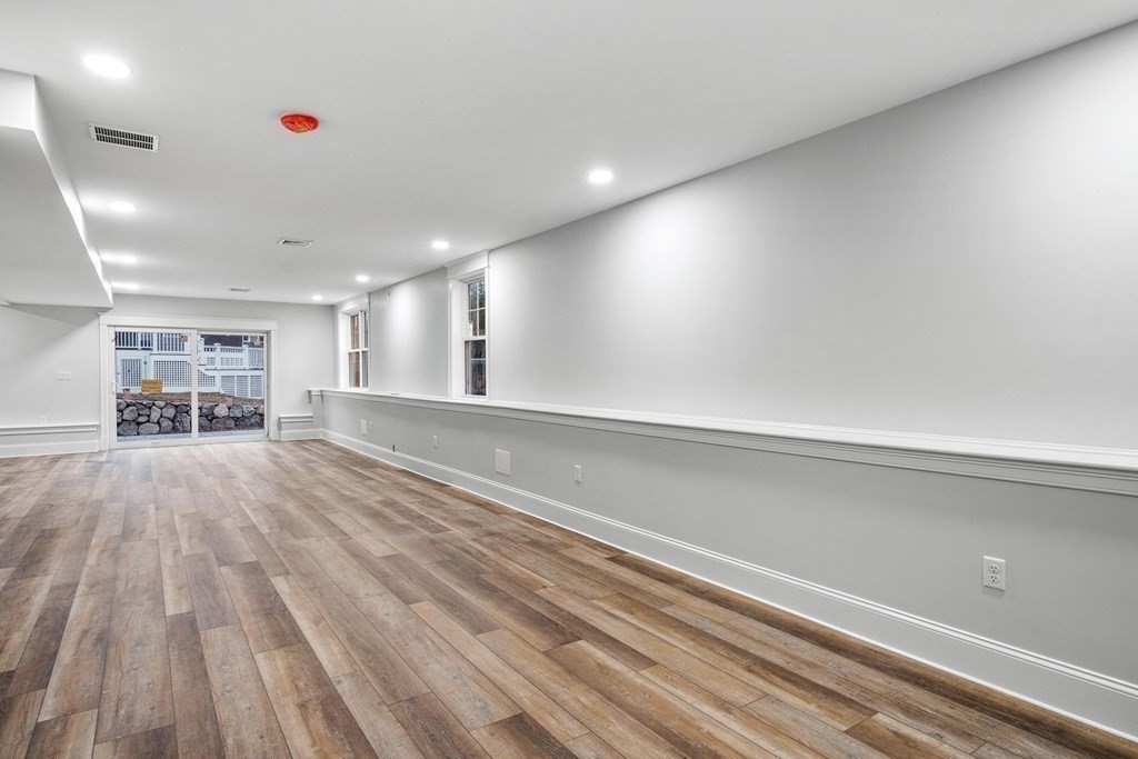 49 Allen Road Winchester, MA 01890 - Photo 36 of 38 a view of empty room with wooden floor
