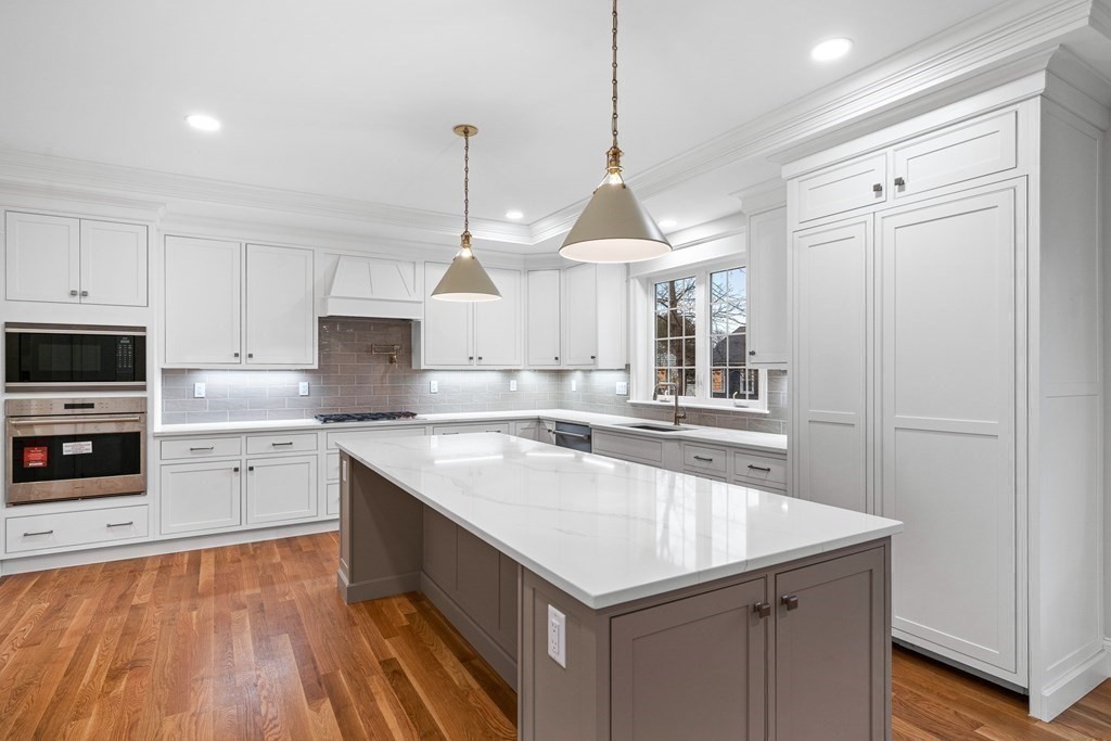 49 Allen Road Winchester, MA 01890 - Photo 6 of 38 a kitchen with granite countertop a sink a counter space appliances and cabinets