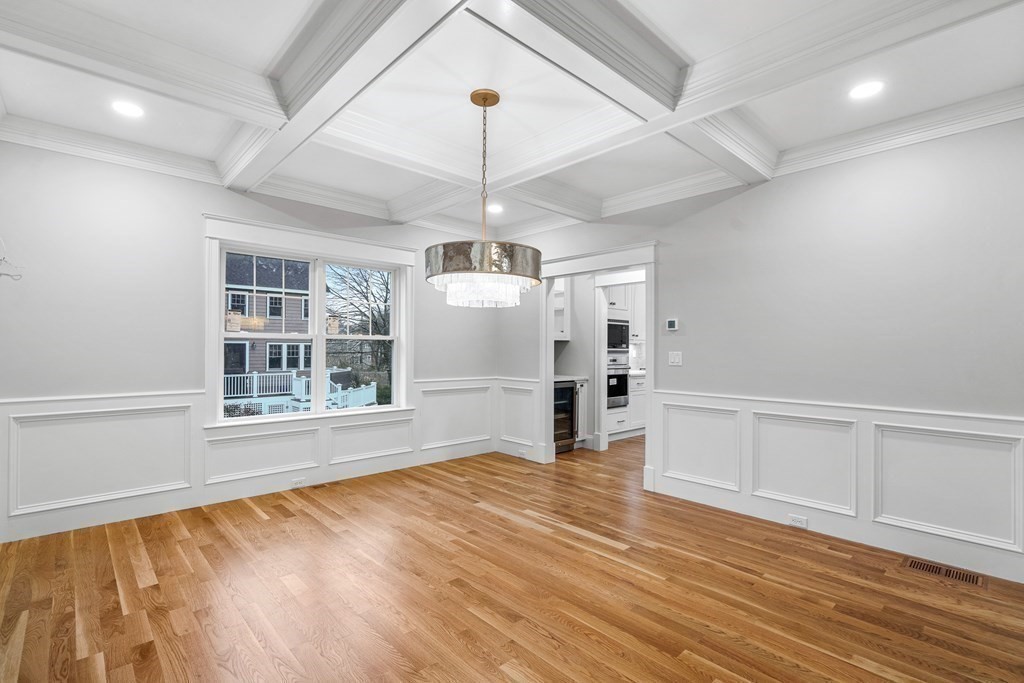 49 Allen Road Winchester, MA 01890 - Photo 8 of 38 an empty room with wooden floor cabinet and windows