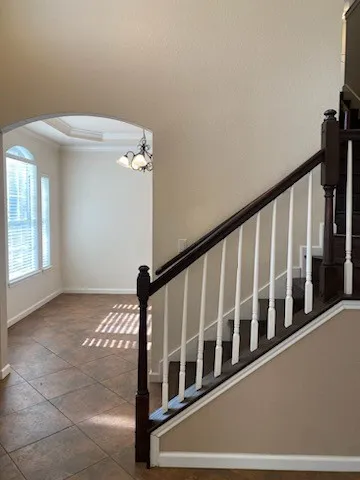 a view of an empty room with a fireplace