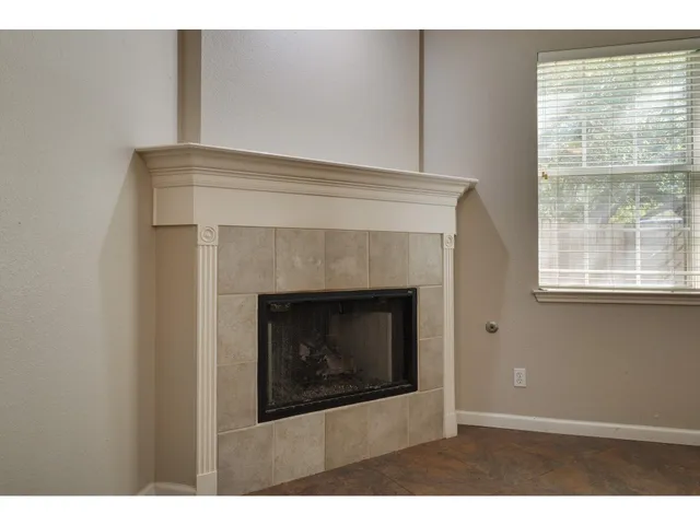 a kitchen with stainless steel appliances granite countertop a sink a stove a microwave a counter top space and cabinets