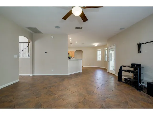 a kitchen with stainless steel appliances granite countertop a sink a stove and cabinets