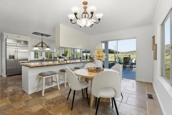 a living room with furniture a window and a fireplace