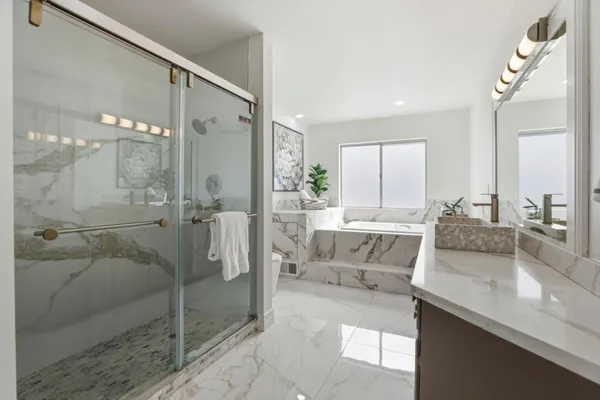 a bathroom with a sink a faucet and a mirror