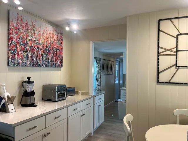 a bathroom with a toilet a sink and glass door