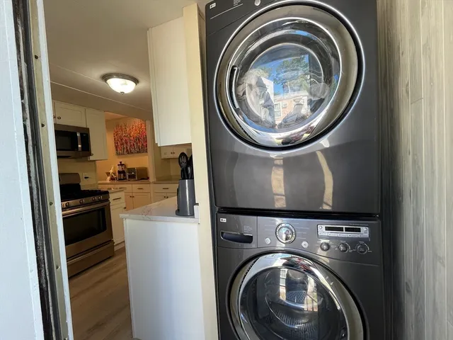 a view of a kitchen with washer and dryer
