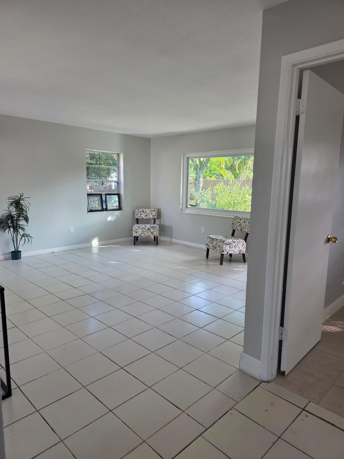 3386 Rudolph Road Lake Worth Beach, FL 33461 - Photo 9 of 25 a view of living room filled with furniture and a window
