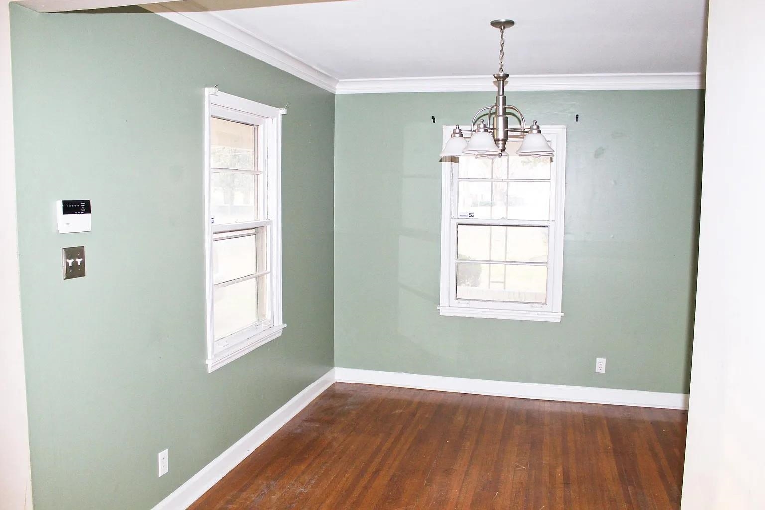 1606 Sea Isle Road Memphis, TN 38117 - Photo 3 of 7 a view of an empty room with wooden floor and a window