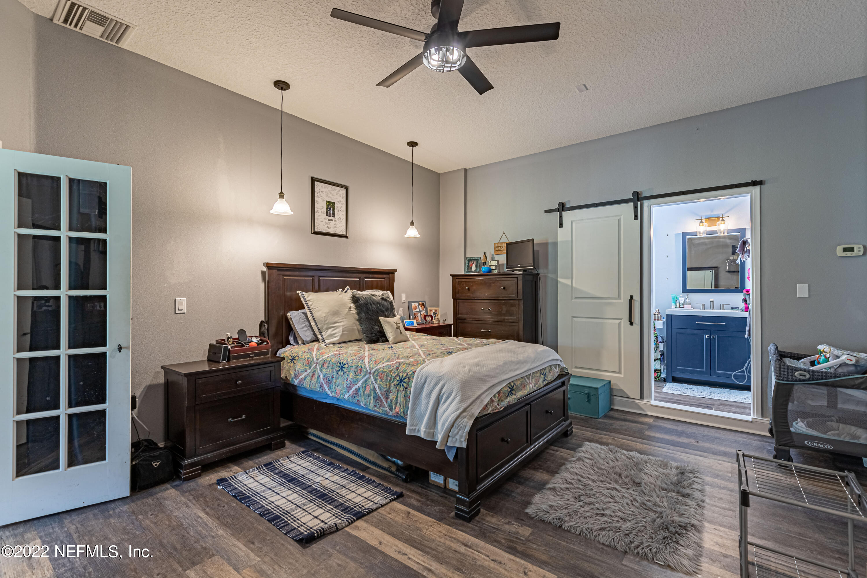 1830 Bennett Road St. Augustine, FL 32092 - Photo 14 of 45 a bedroom with a bed and a refrigerator
