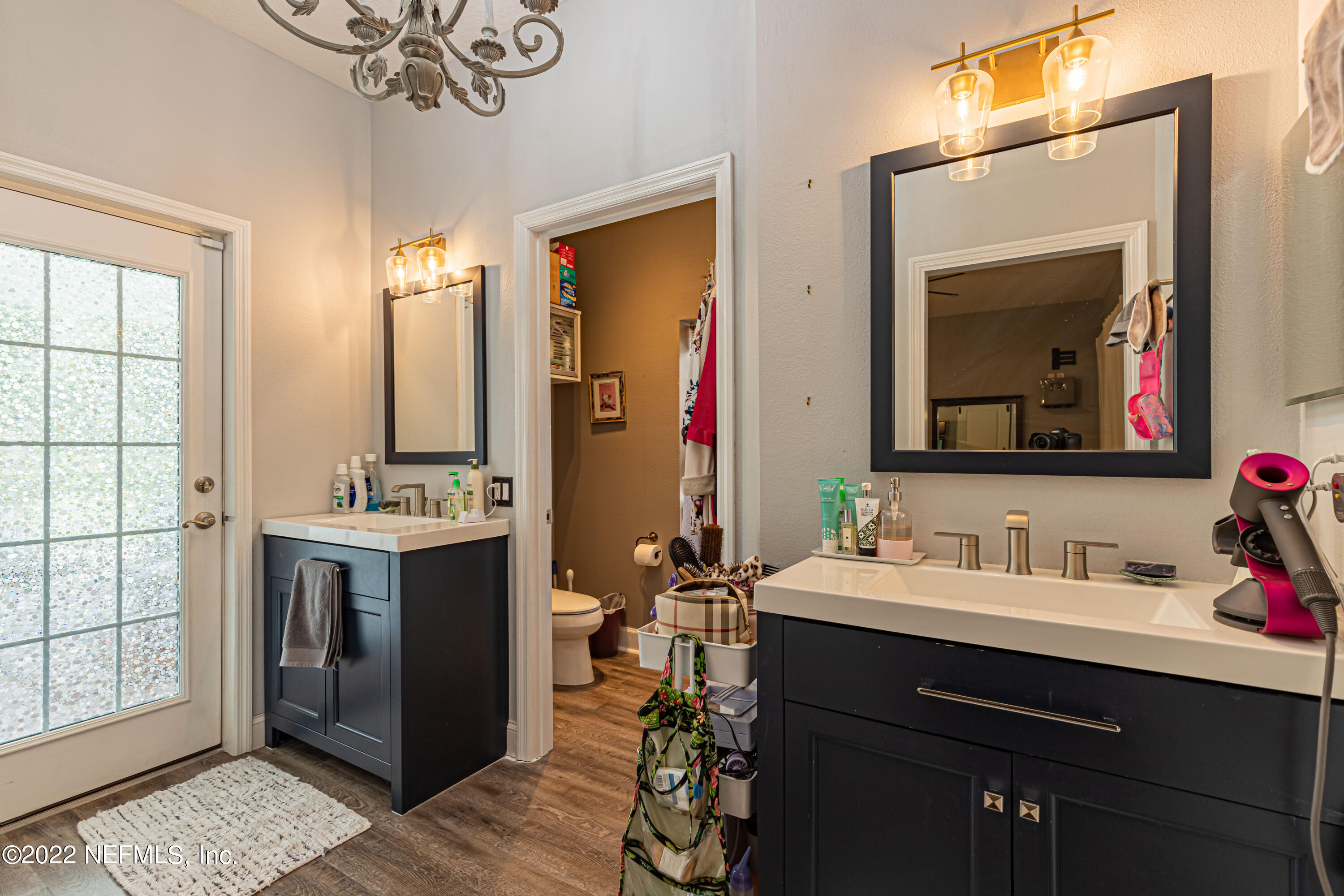 1830 Bennett Road St. Augustine, FL 32092 - Photo 15 of 45 a en suite bathroom with a double vanity sink and a mirror