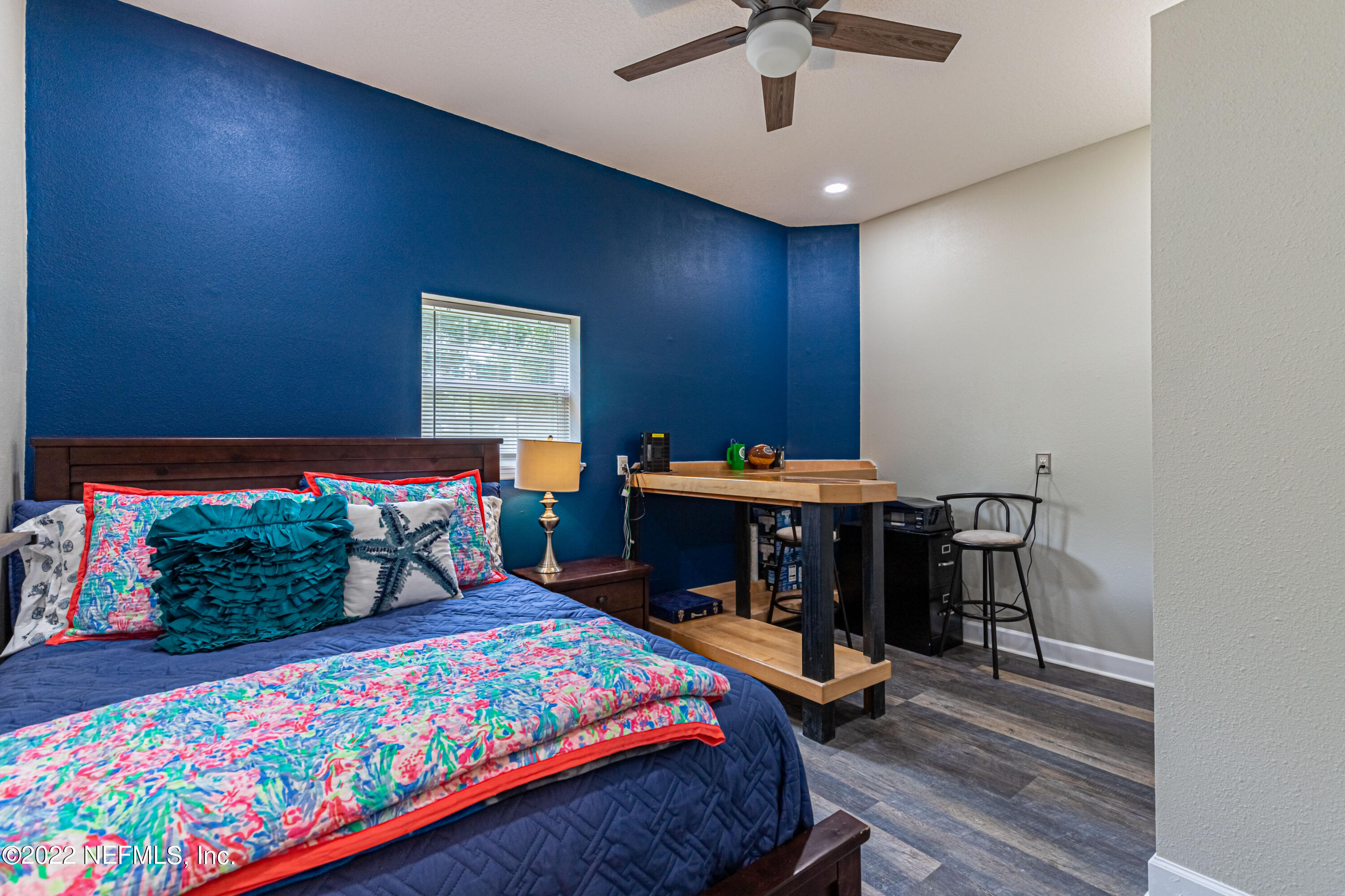 1830 Bennett Road St. Augustine, FL 32092 - Photo 16 of 45 a bedroom with a bed and wooden floor