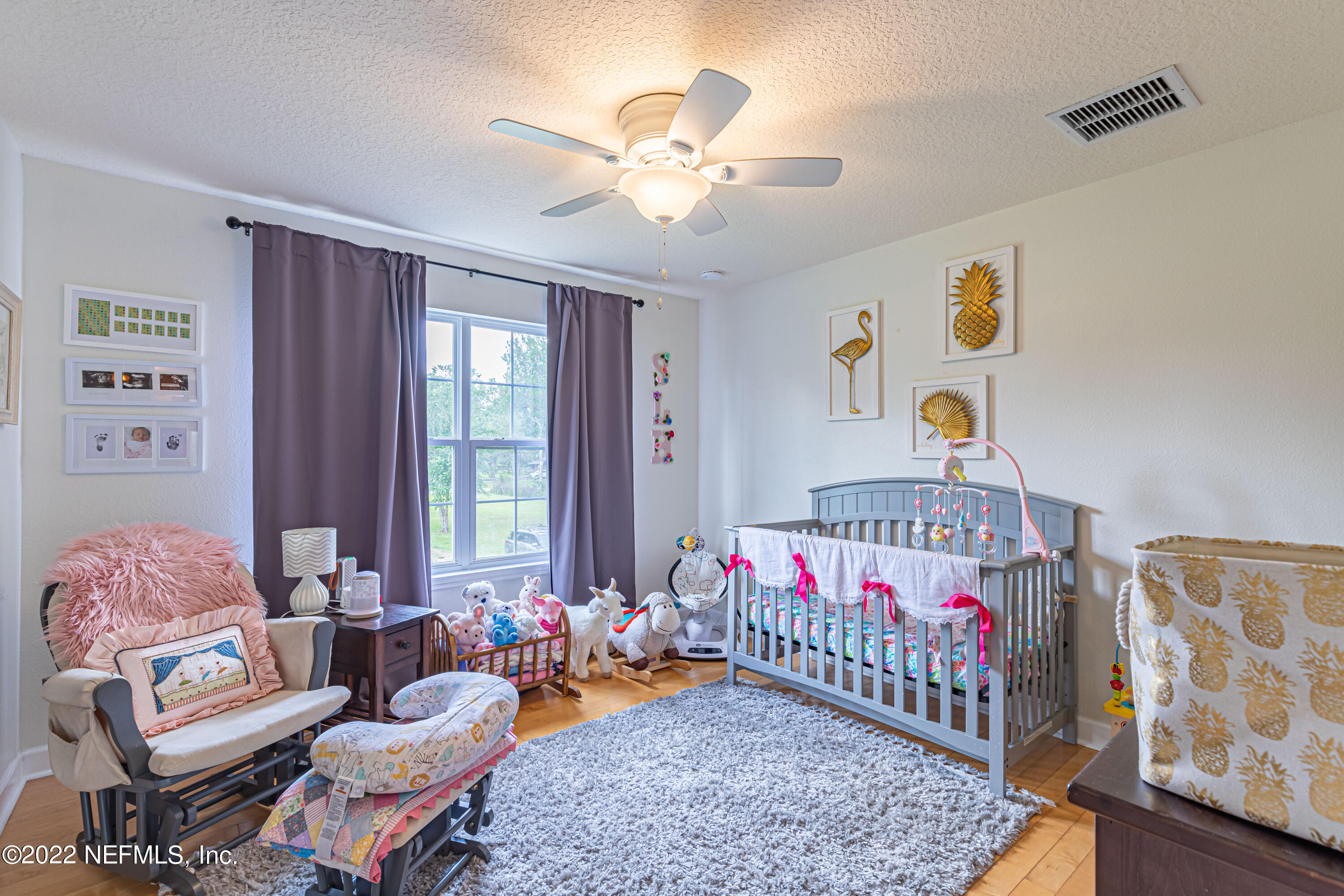 1830 Bennett Road St. Augustine, FL 32092 - Photo 17 of 45 a living room with furniture and baby crib