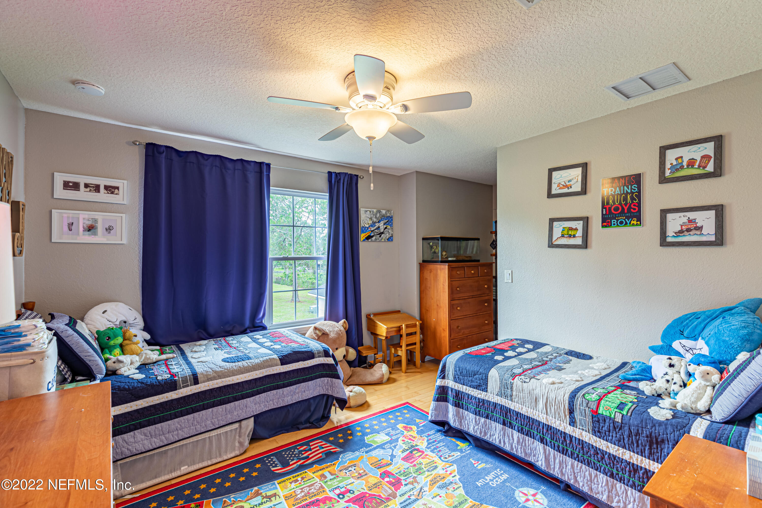 1830 Bennett Road St. Augustine, FL 32092 - Photo 18 of 45 a bedroom with furniture and a rug