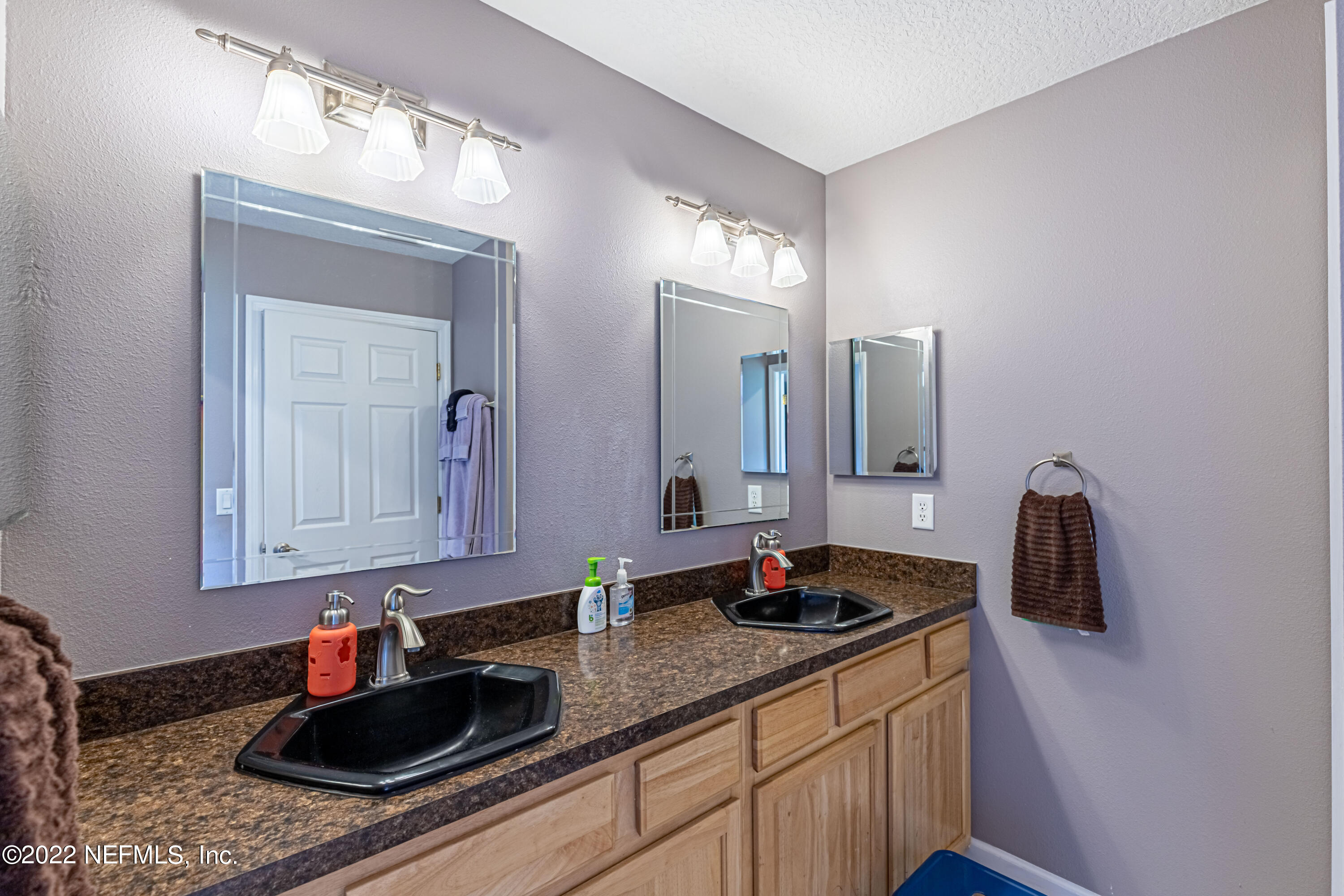 1830 Bennett Road St. Augustine, FL 32092 - Photo 19 of 45 a bathroom with sink double vanity and mirror