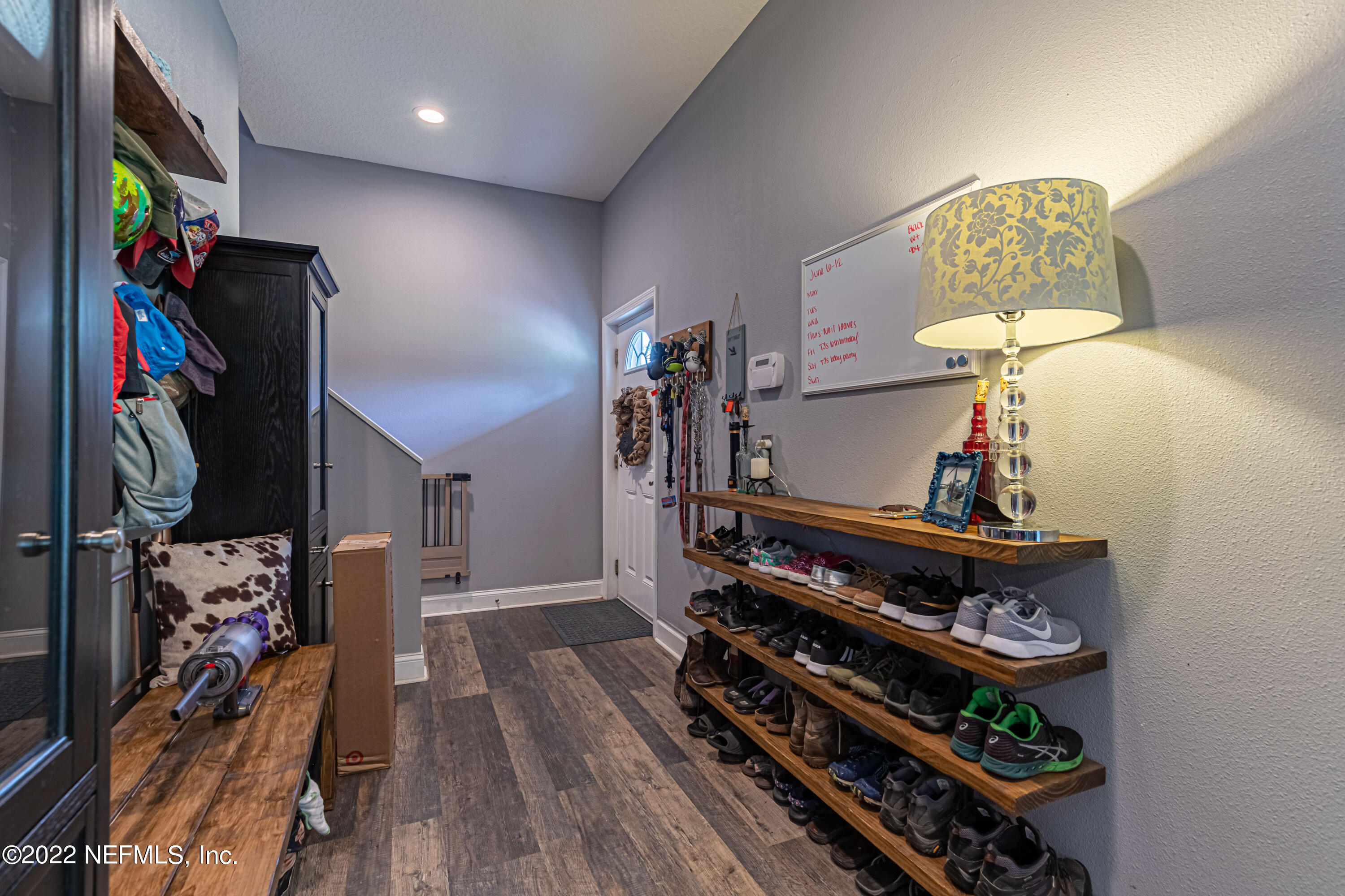 1830 Bennett Road St. Augustine, FL 32092 - Photo 23 of 45 a view of a hallway with wooden floor and workspace