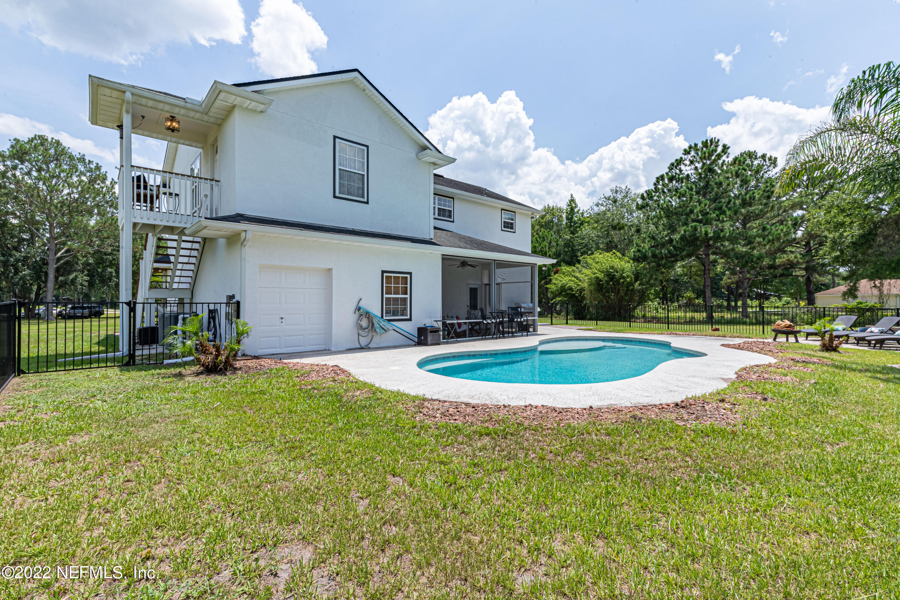 1830 Bennett Road St. Augustine, FL 32092 - Photo 24 of 45 a view of a house with swimming pool and a yard