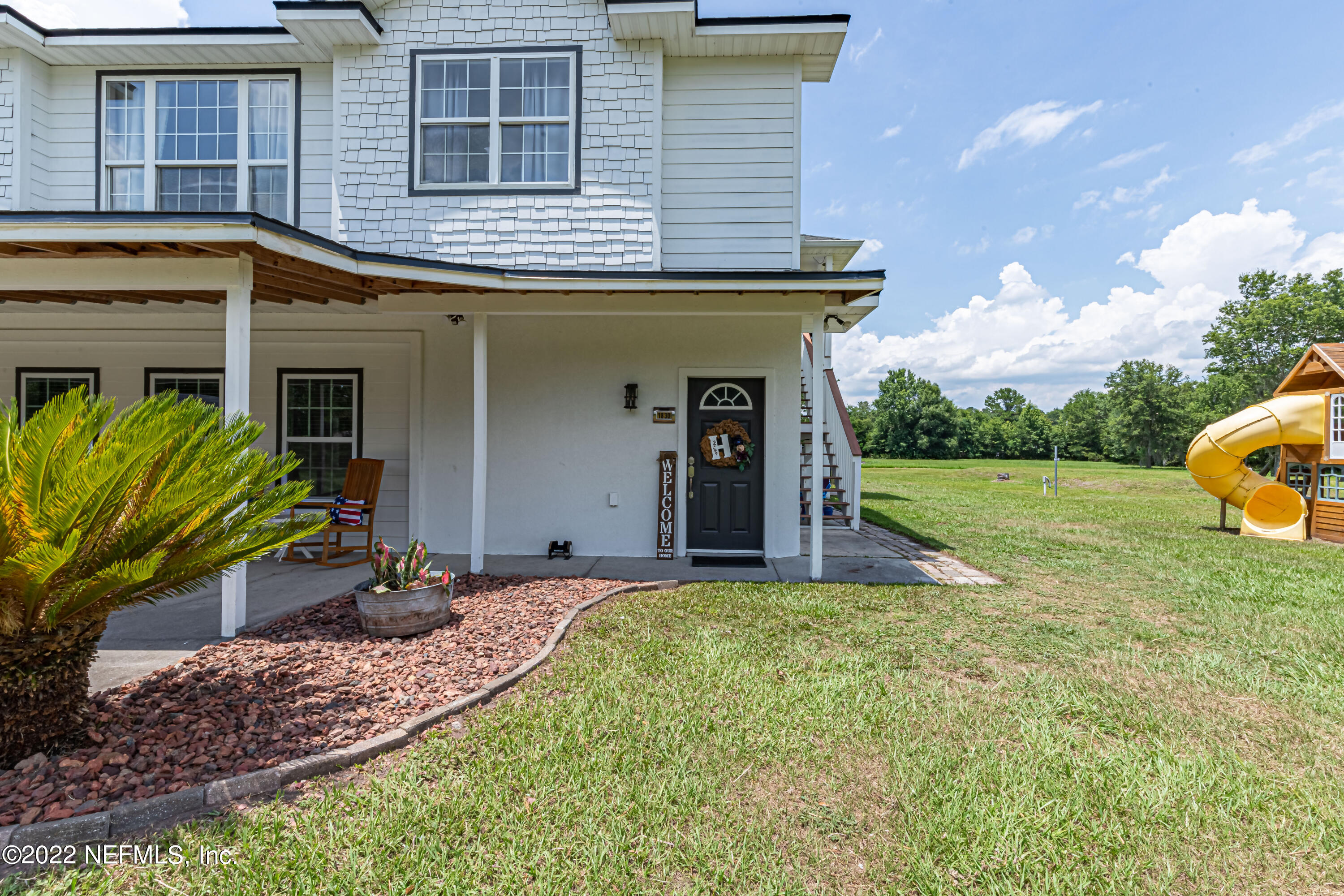 1830 Bennett Road St. Augustine, FL 32092 - Photo 32 of 45 a view of a house with backyard and porch