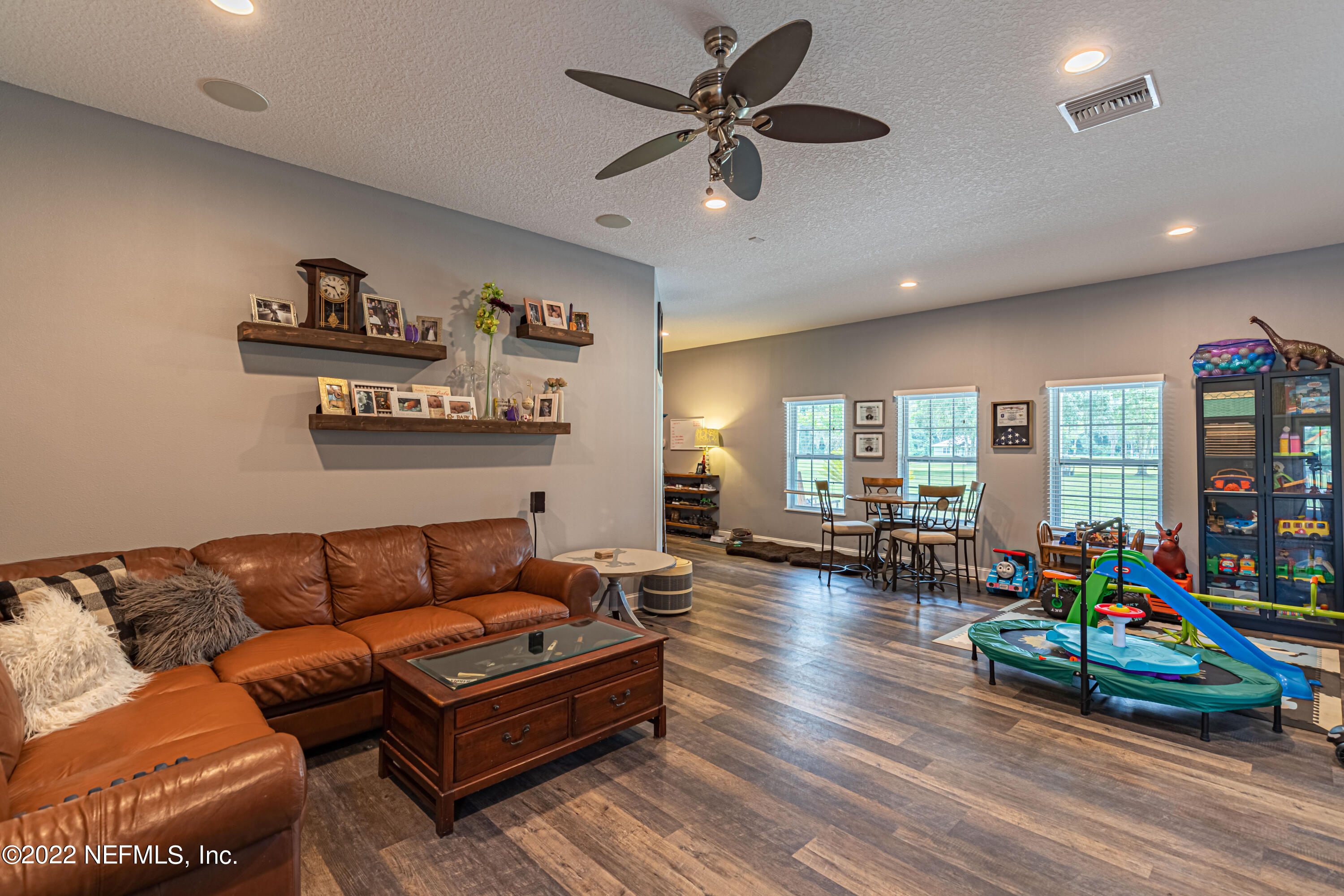 1830 Bennett Road St. Augustine, FL 32092 - Photo 33 of 45 a living room with furniture and a wooden floor