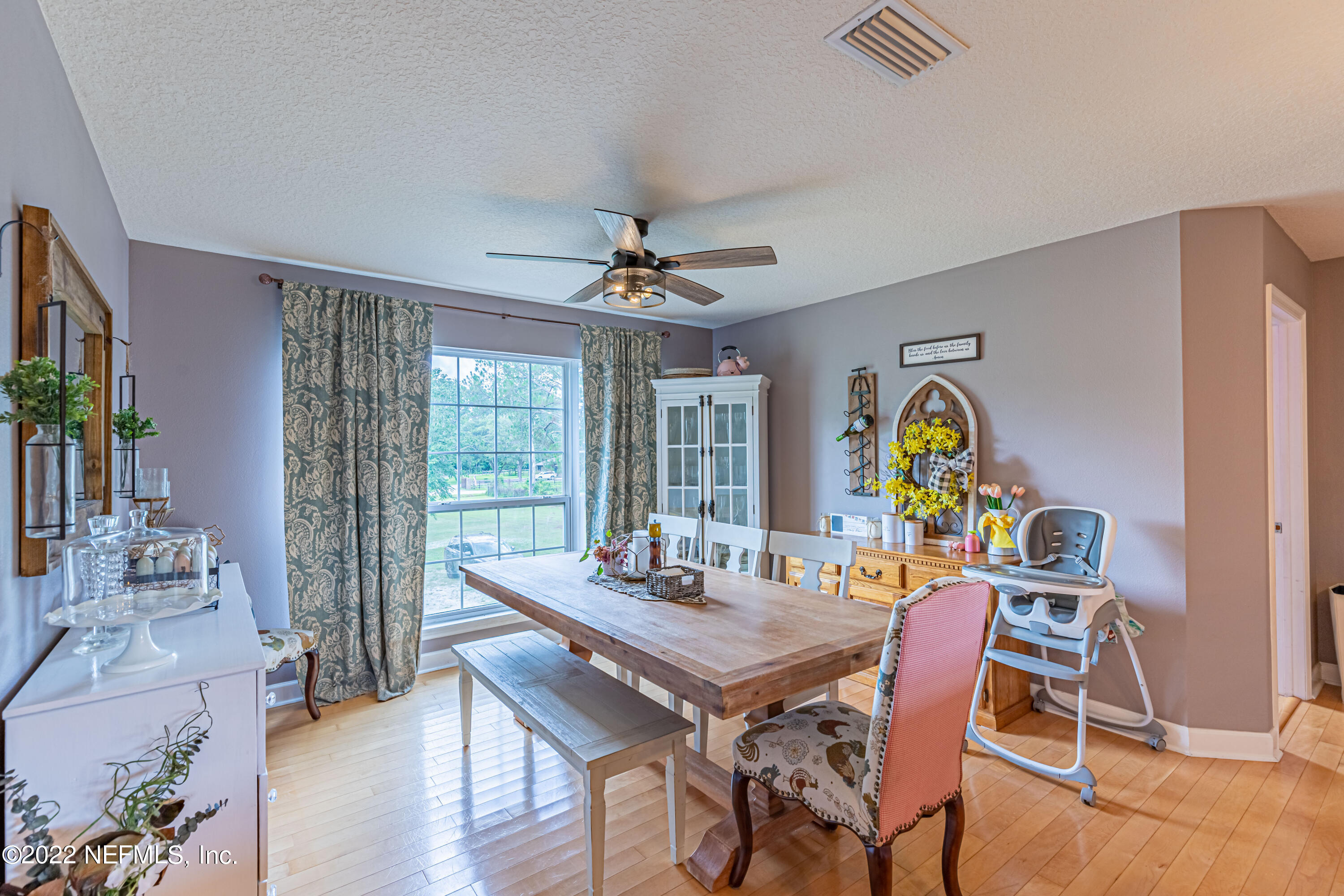 1830 Bennett Road St. Augustine, FL 32092 - Photo 34 of 45 a view of a dining room with furniture a chandelier and wooden floor
