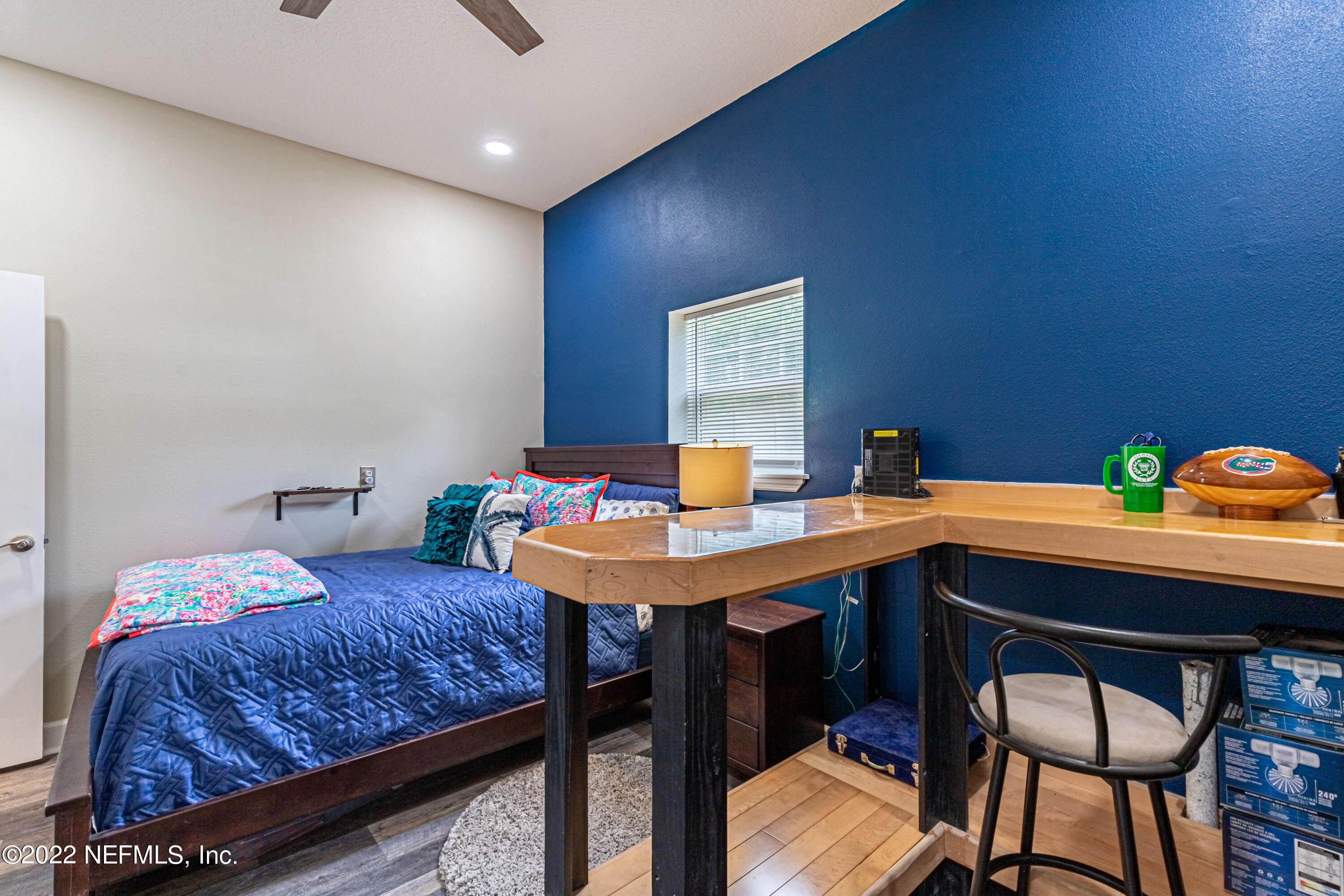 1830 Bennett Road St. Augustine, FL 32092 - Photo 38 of 45 a bedroom with a table chairs and a bed