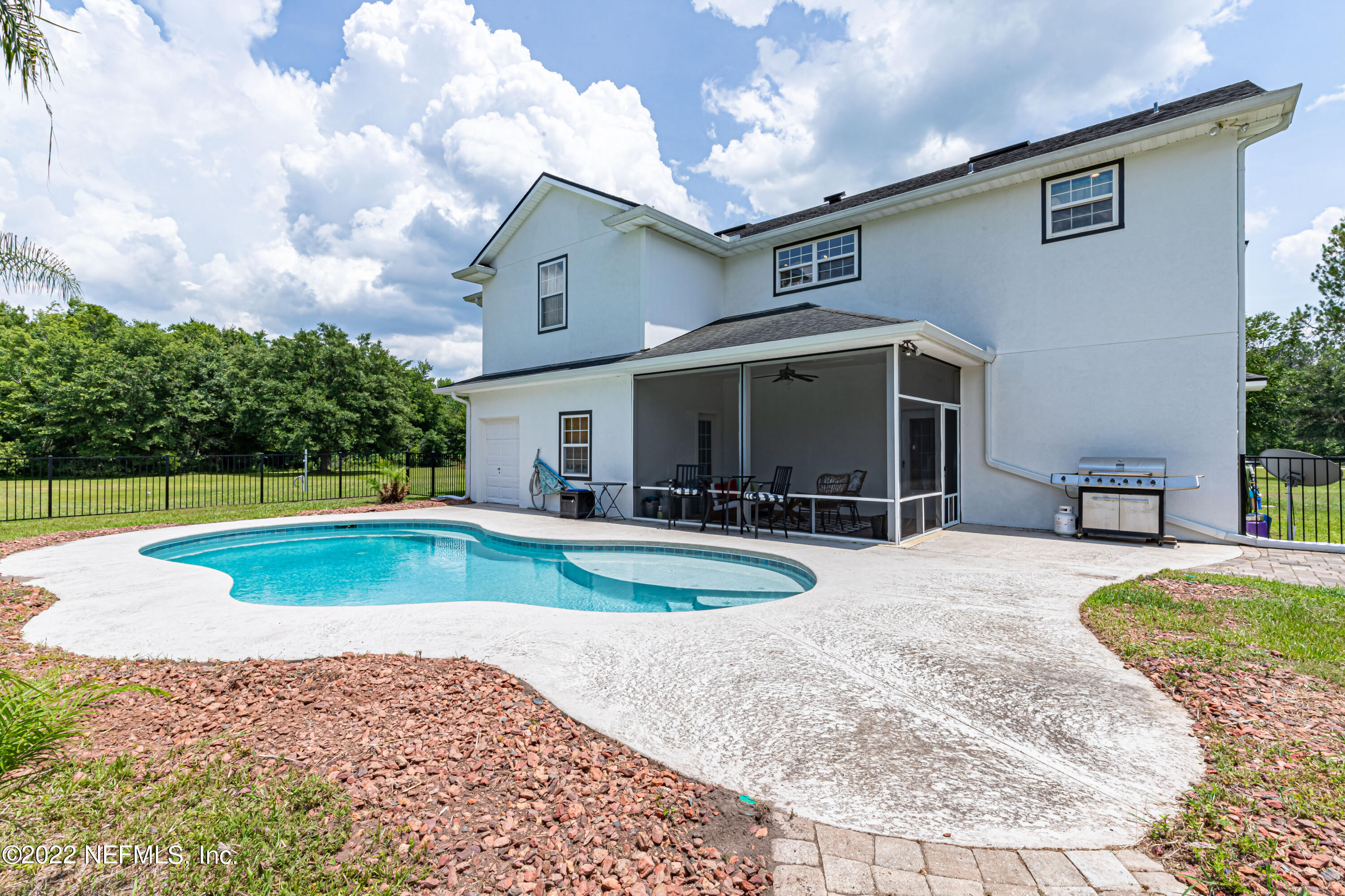 1830 Bennett Road St. Augustine, FL 32092 - Photo 39 of 45 a view of a house with swimming pool and a yard