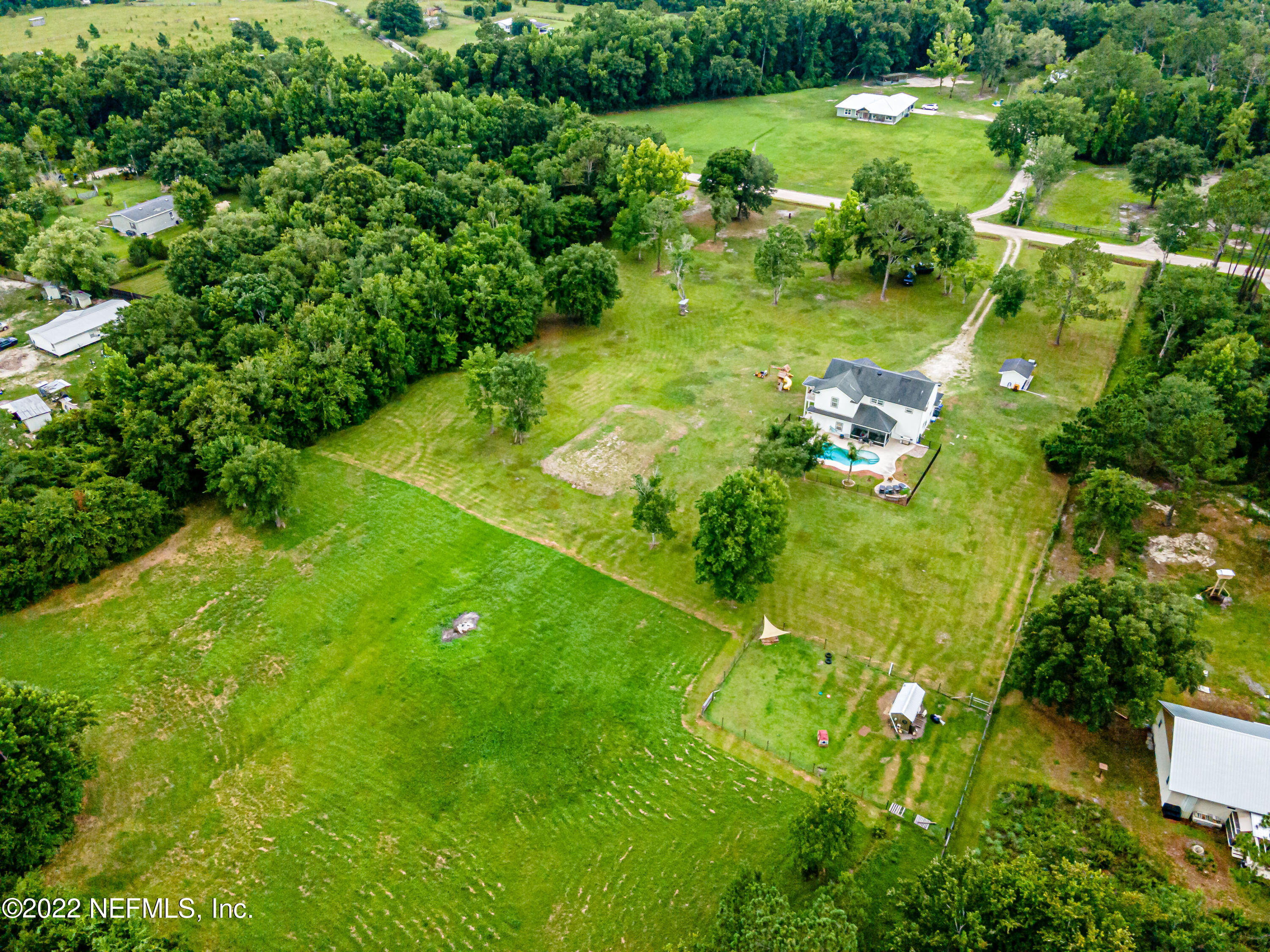 1830 Bennett Road St. Augustine, FL 32092 - Photo 4 of 45 a lush green forest with lots of trees