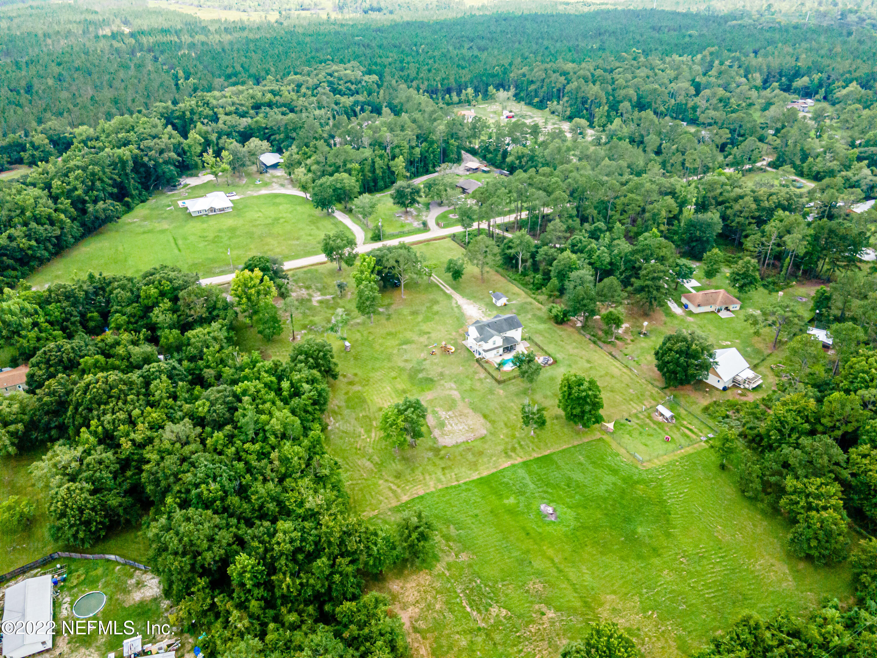 1830 Bennett Road St. Augustine, FL 32092 - Photo 42 of 45 a view of a green yard with large trees