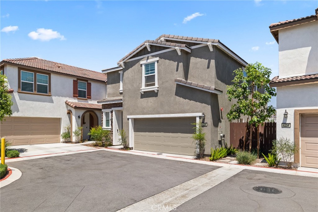 4255 Bravado Riverside, CA 92505 - Photo 1 of 1 a front view of a house with a yard and garage