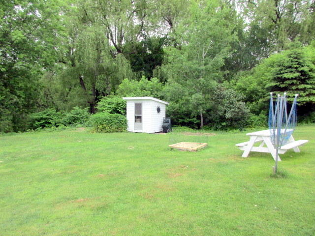 517 Cushman Road Winslow, ME 04901 - Photo 23 of 27 Back yard with shed